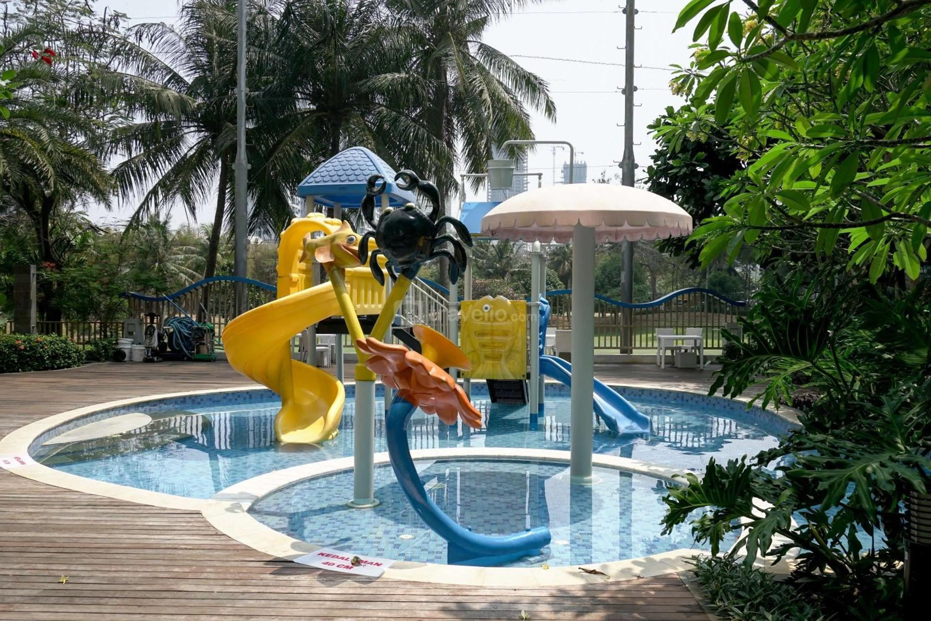 Swimming pool in Minimalist Design 2BR Apartment The Mansion Kemayoran near JIEXPO By Travelio