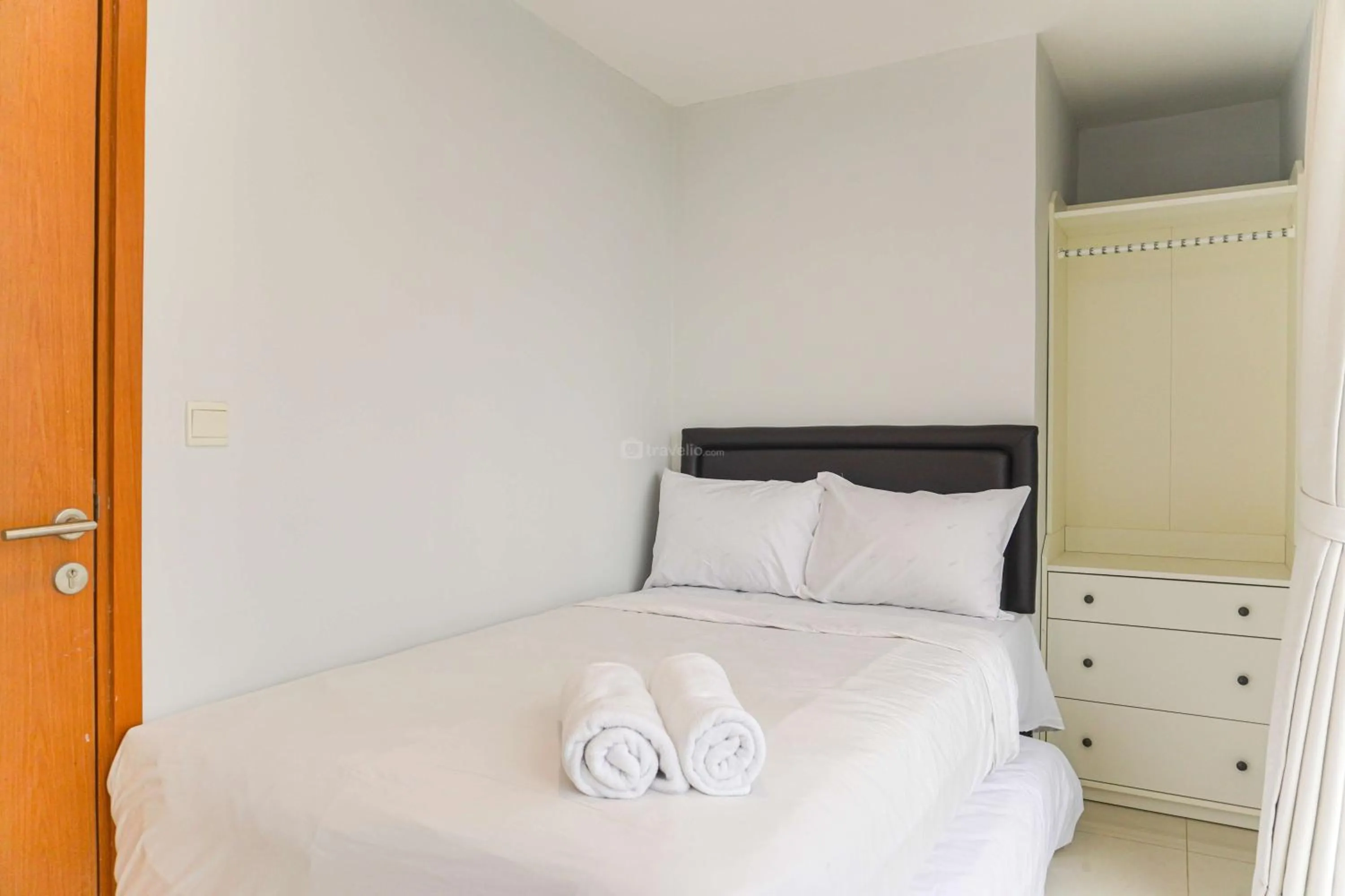 Bed in Minimalist Design 2BR Apartment The Mansion Kemayoran near JIEXPO By Travelio