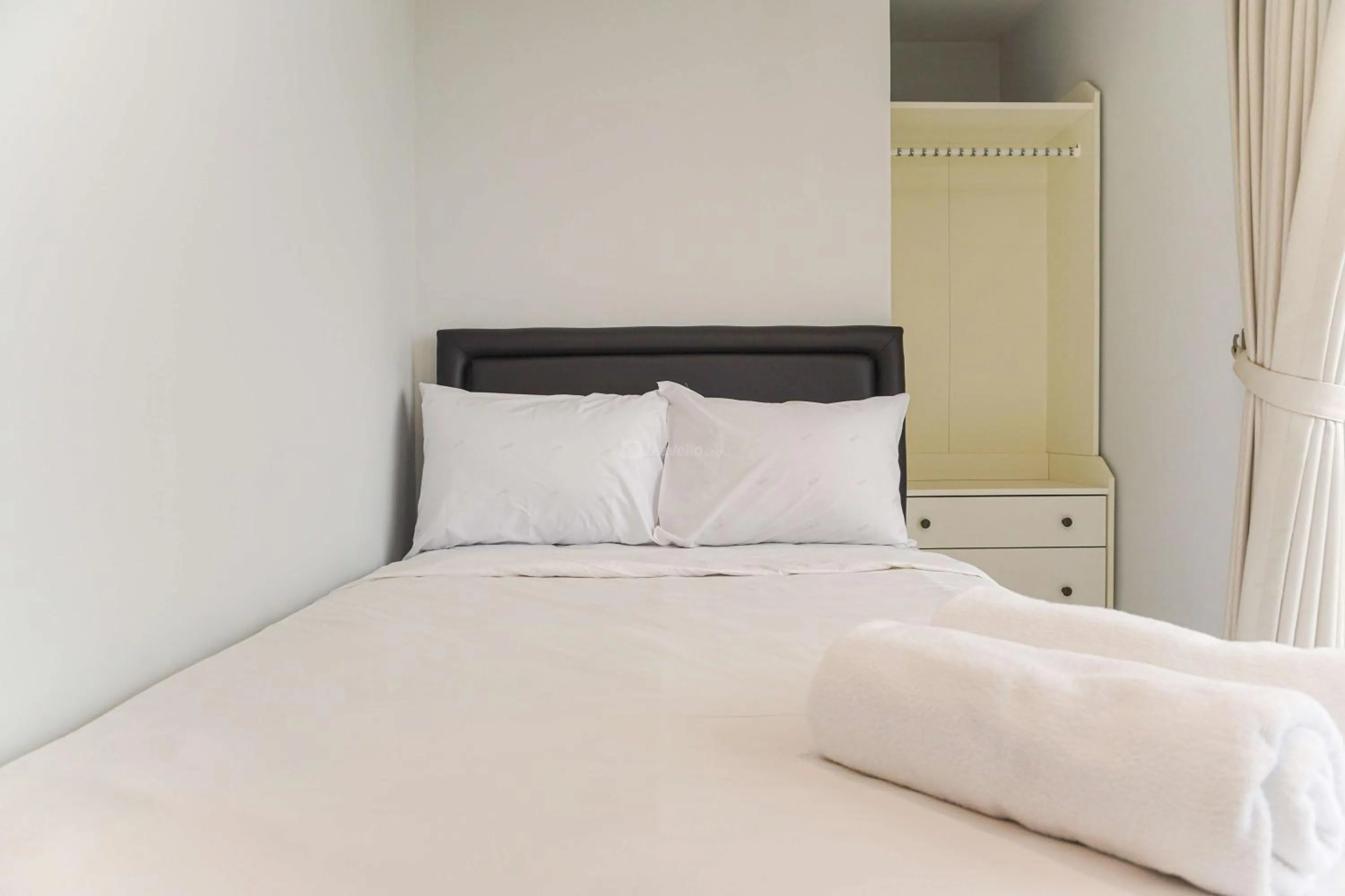 Bed in Minimalist Design 2BR Apartment The Mansion Kemayoran near JIEXPO By Travelio