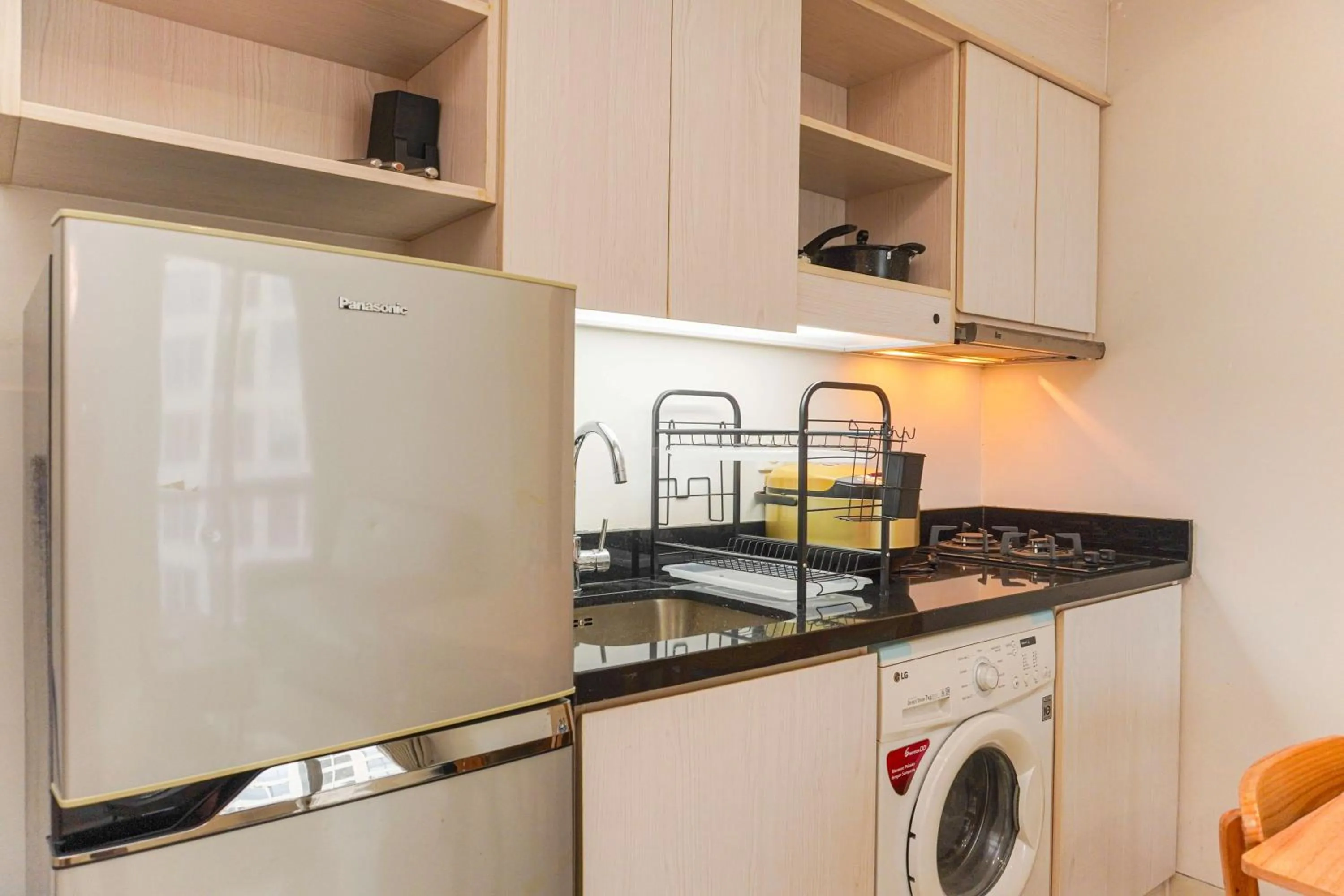 Bed in Minimalist Design 2BR Apartment The Mansion Kemayoran near JIEXPO By Travelio