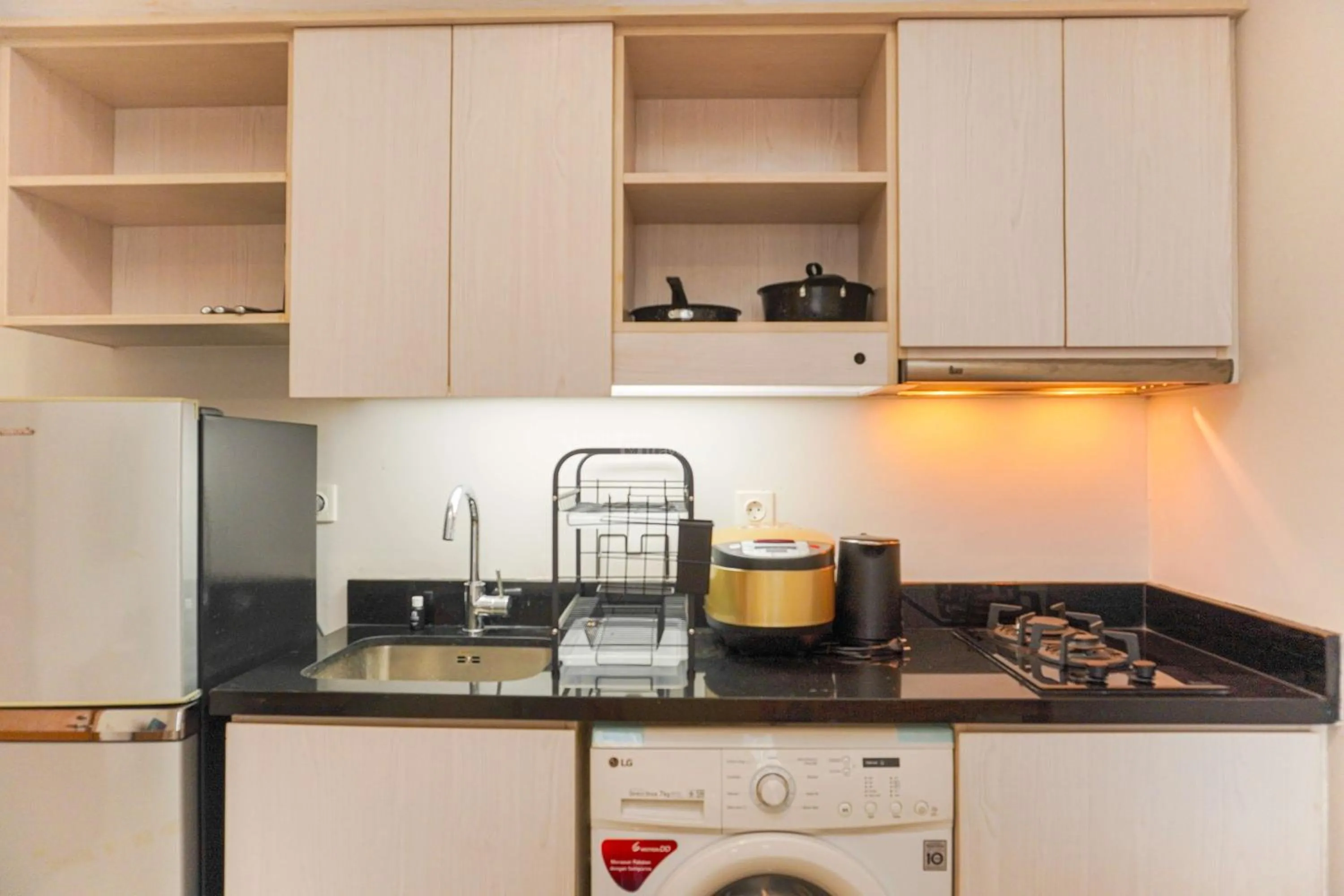 Bed in Minimalist Design 2BR Apartment The Mansion Kemayoran near JIEXPO By Travelio