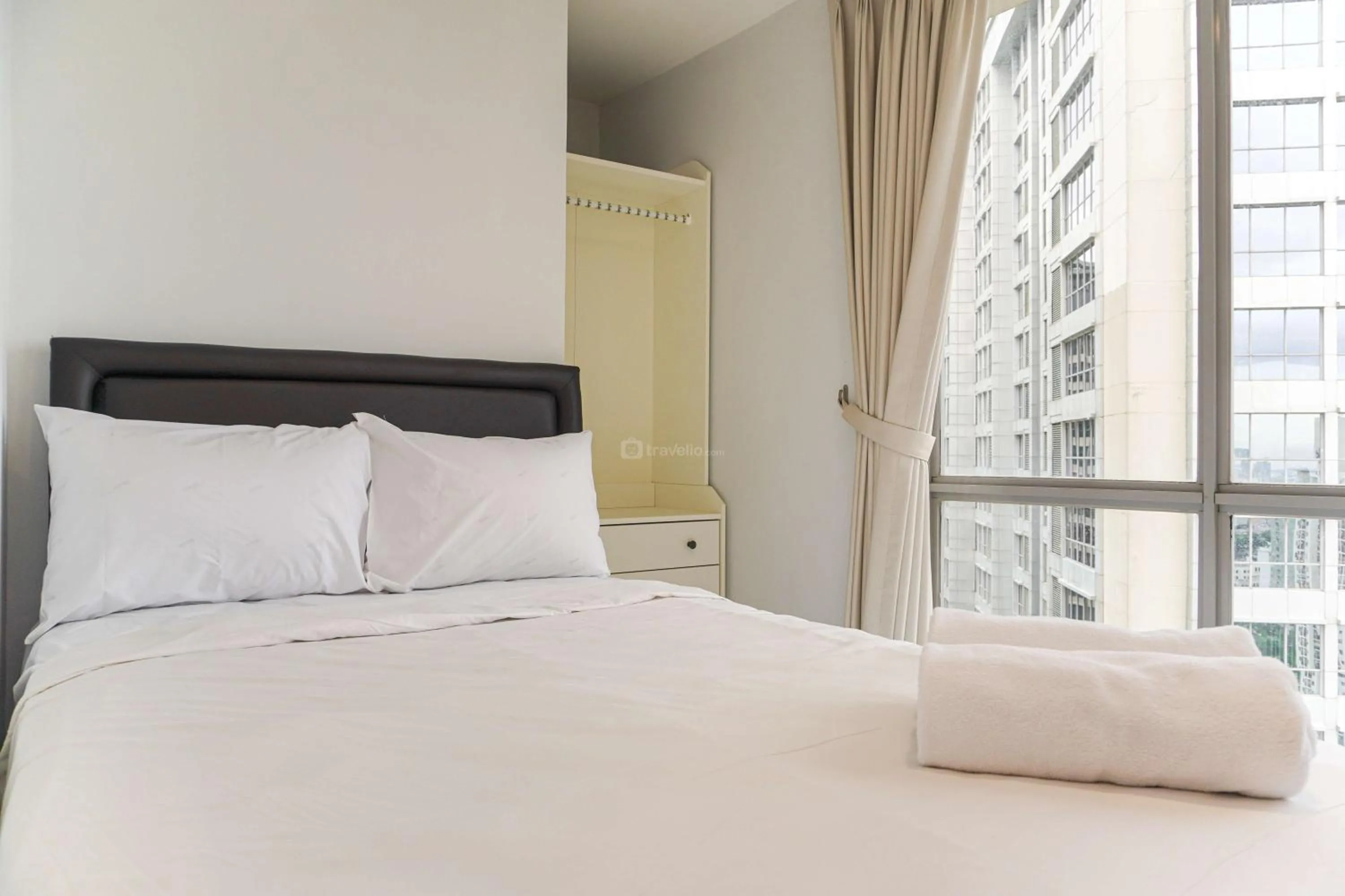 Bed in Minimalist Design 2BR Apartment The Mansion Kemayoran near JIEXPO By Travelio