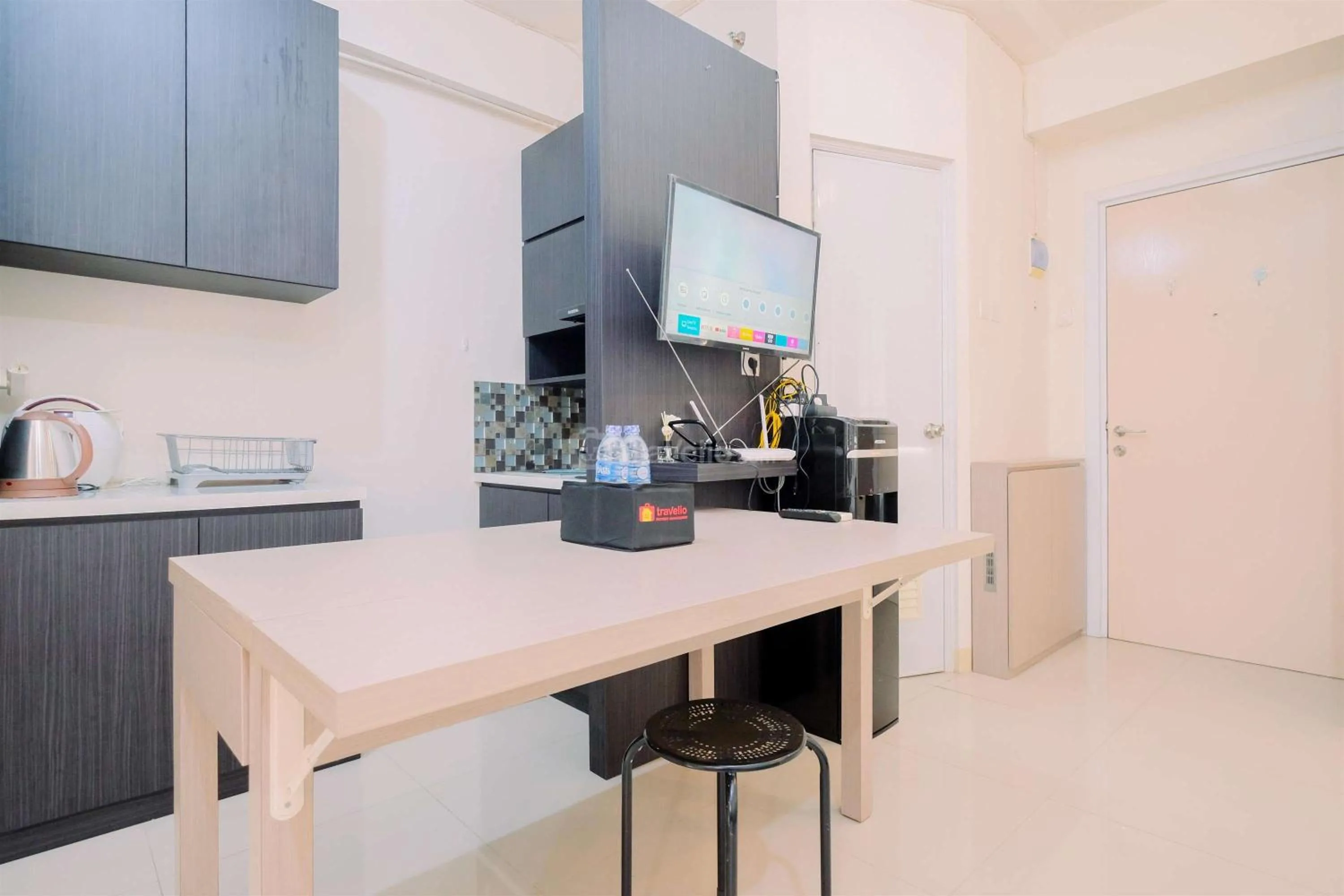 Bed in Good Deal and Cozy Studio Green Pramuka City Apartment By Travelio