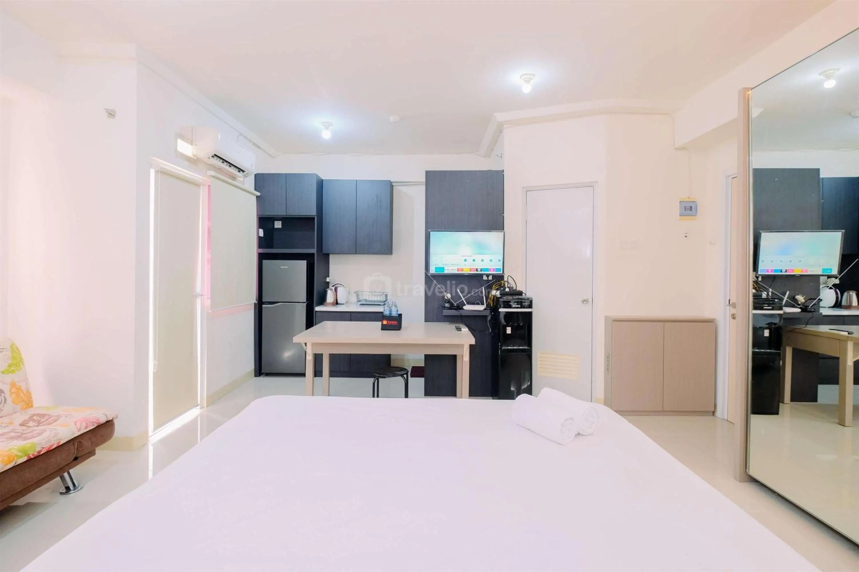 Bed in Good Deal and Cozy Studio Green Pramuka City Apartment By Travelio