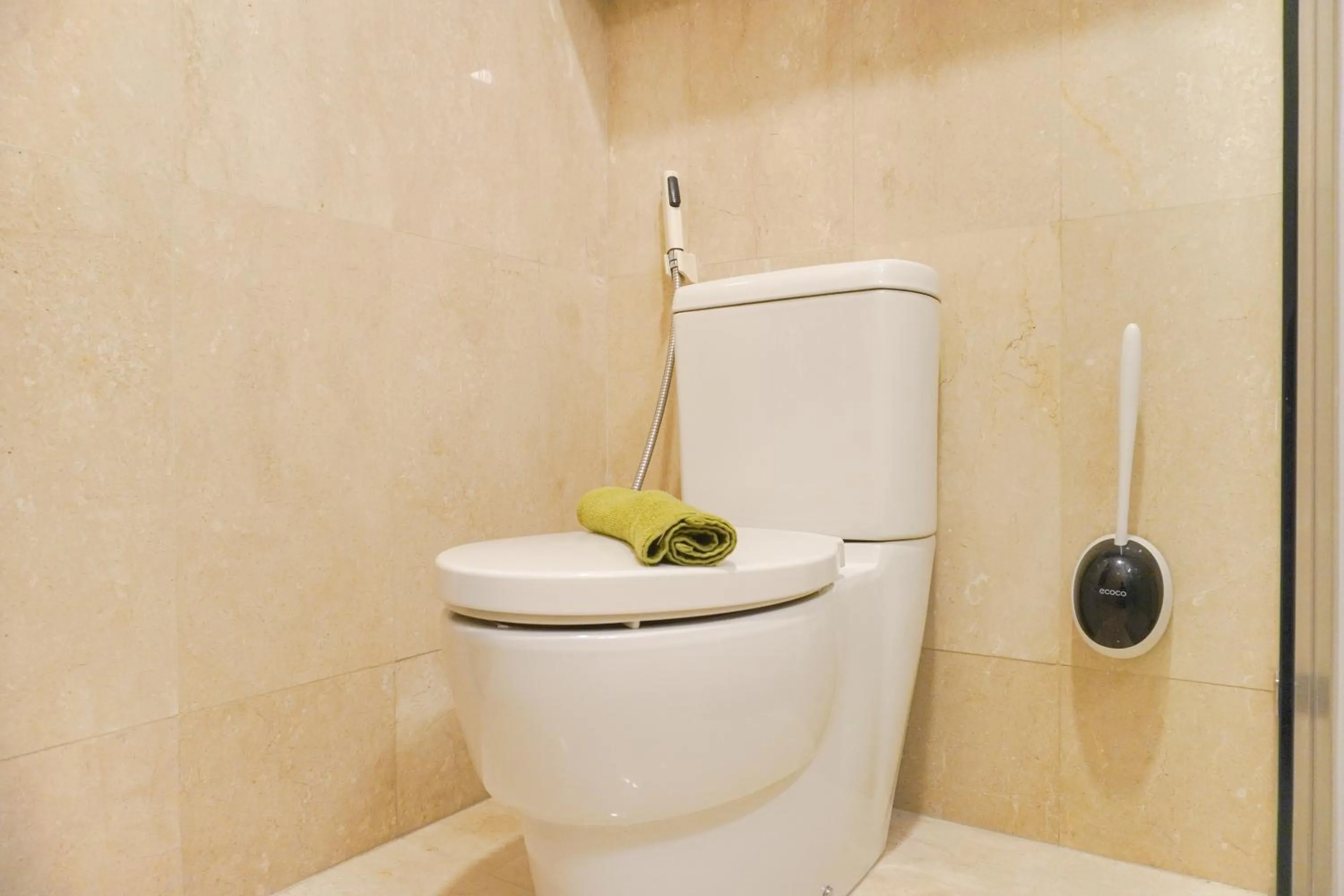 Bathroom in Comfort and Elegant 2BR Sudirman Suites Apartment By Travelio