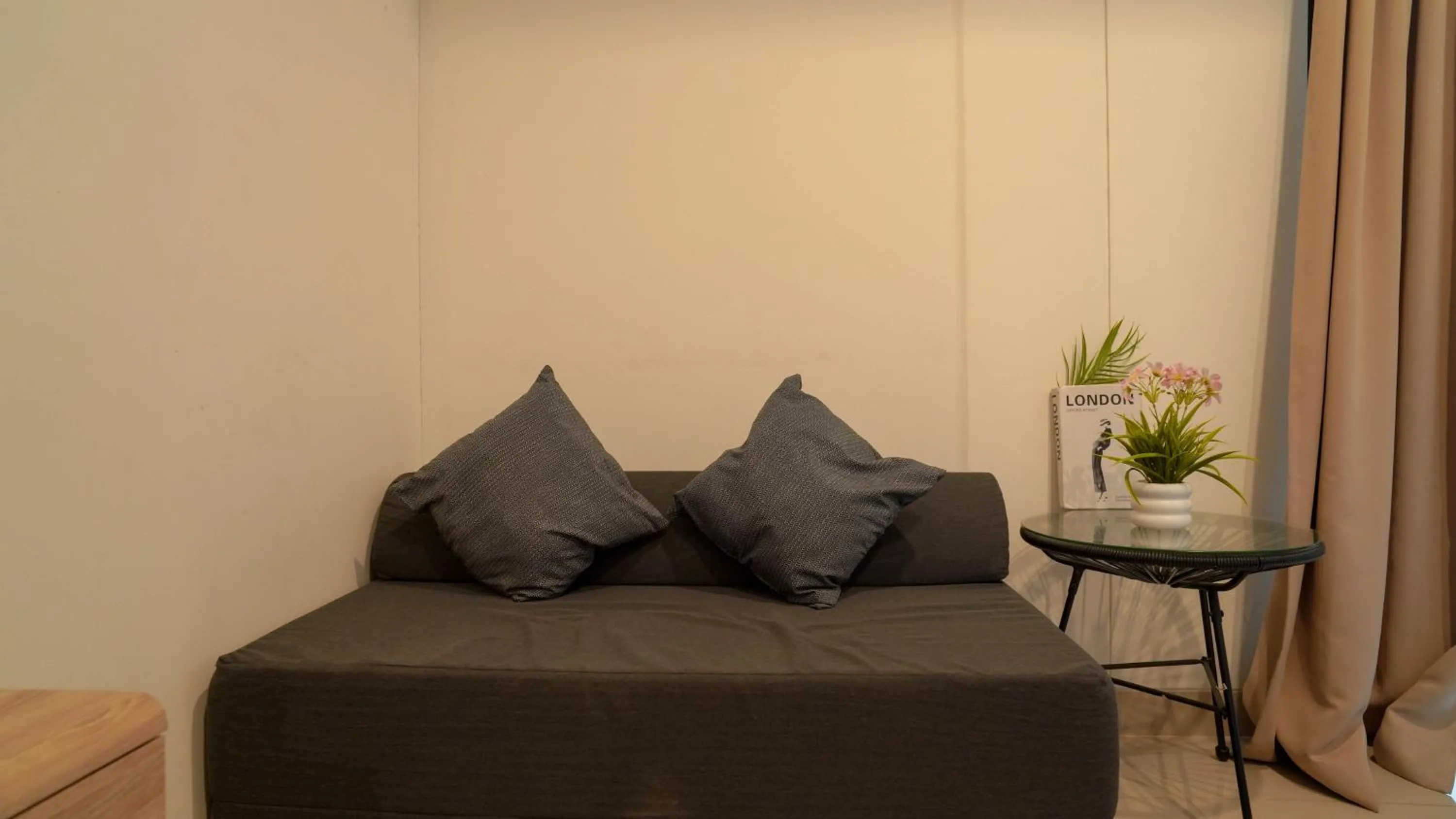 Living room in Spacious and Homey Studio at Cleon Park Apartment By Travelio