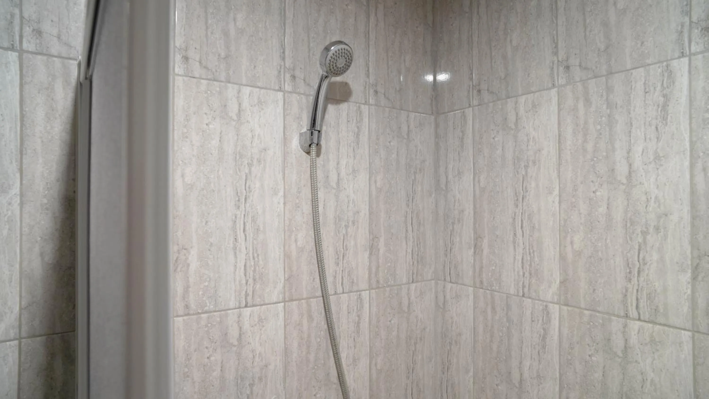 Bathroom in Spacious and Homey Studio at Cleon Park Apartment By Travelio