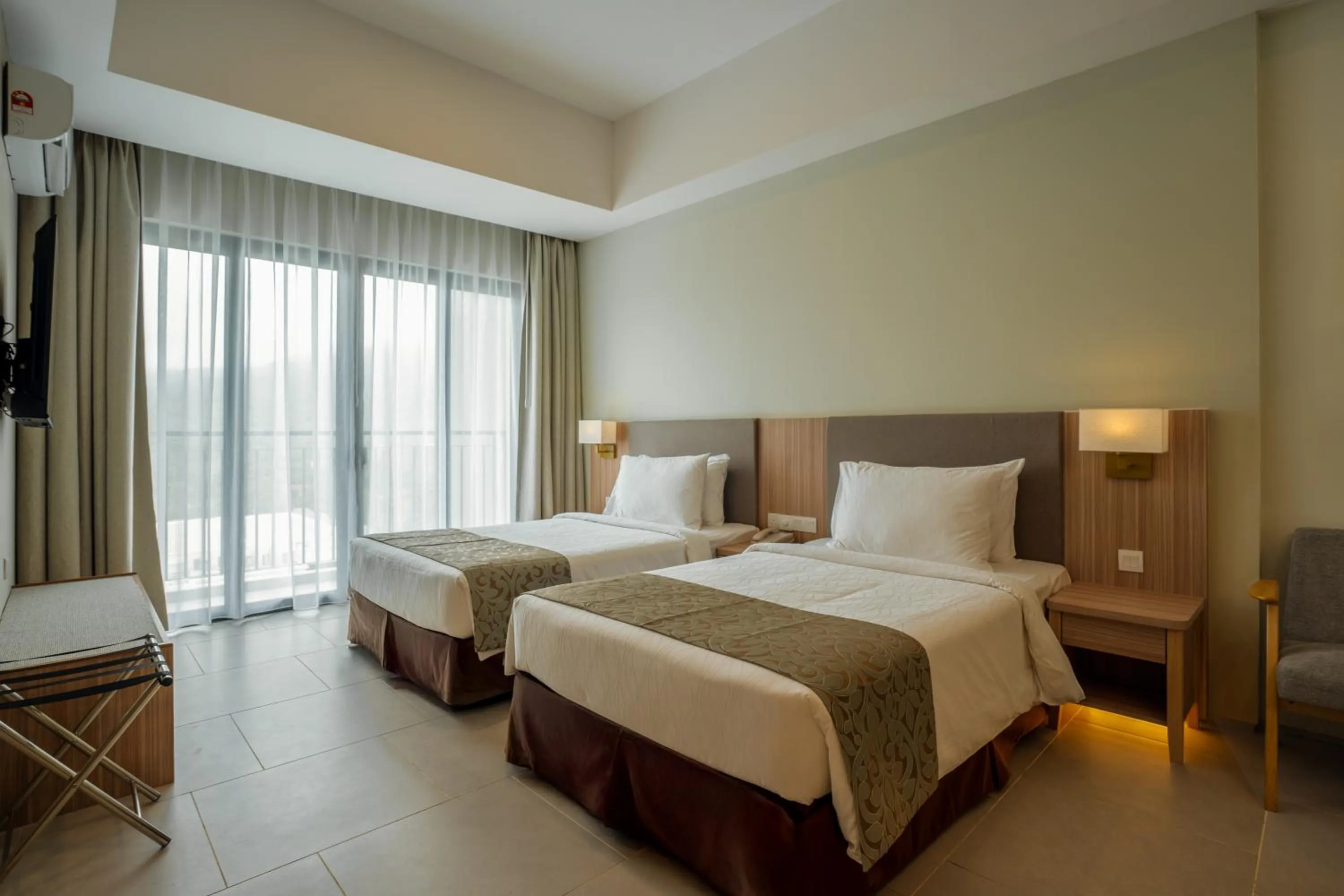 Bed in Zenith Suites Cameron