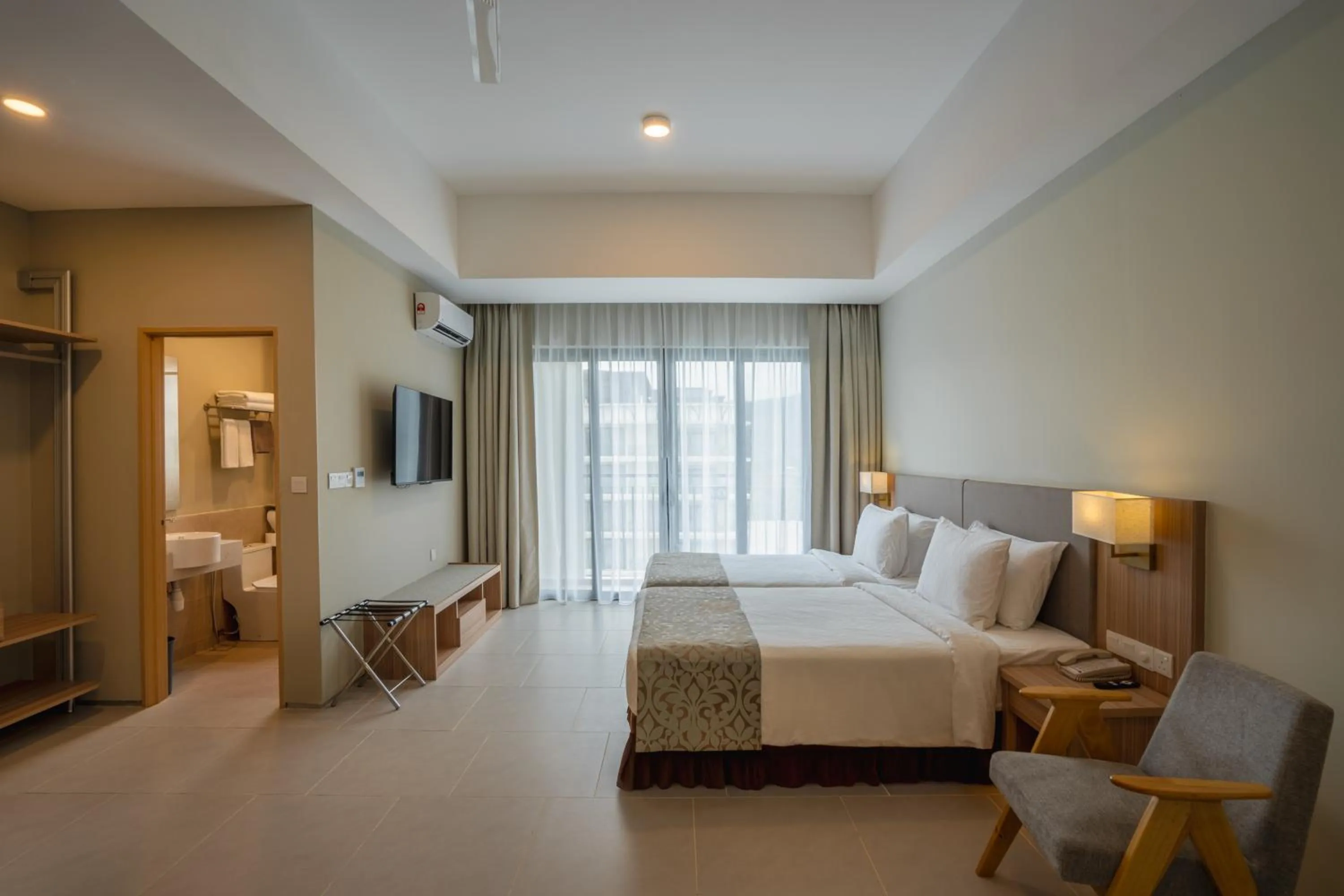 Bed in Zenith Suites Cameron