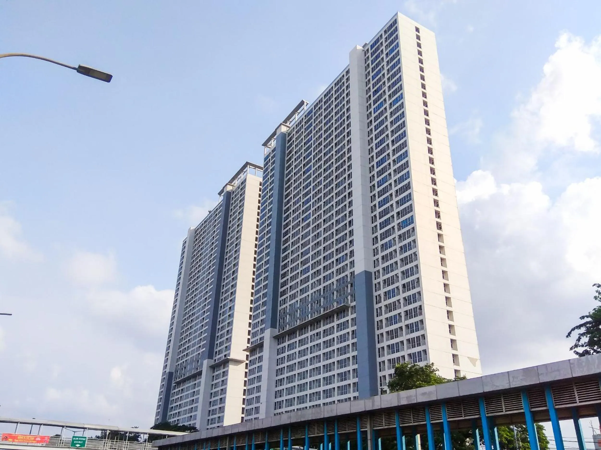 Property building in Modern Look and Comfy Studio Tifolia Apartment By Travelio