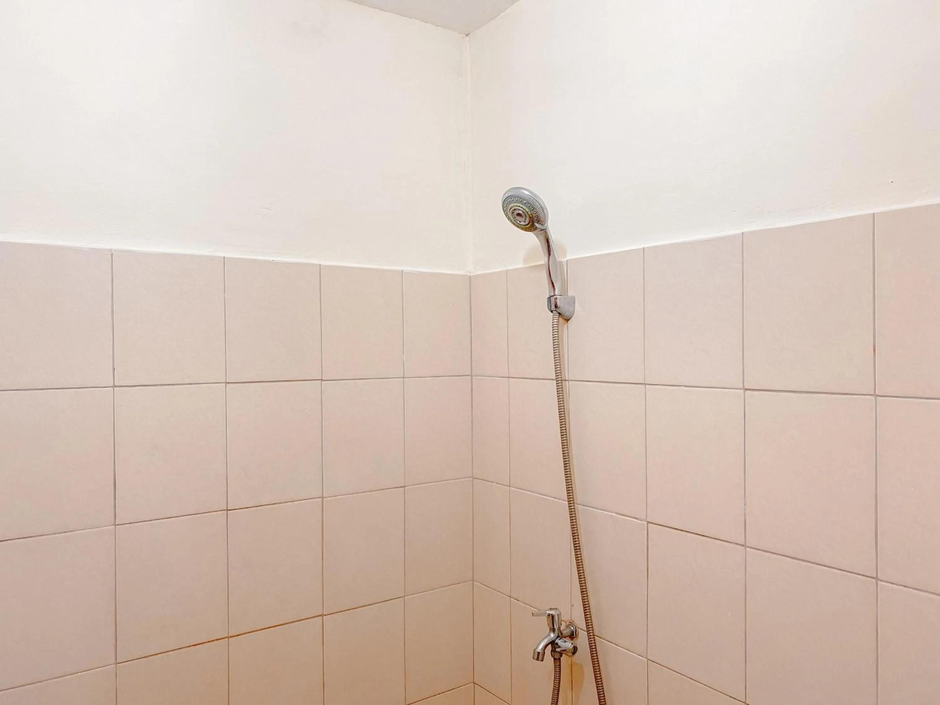 Bathroom in Modern Look and Comfy Studio Tifolia Apartment By Travelio