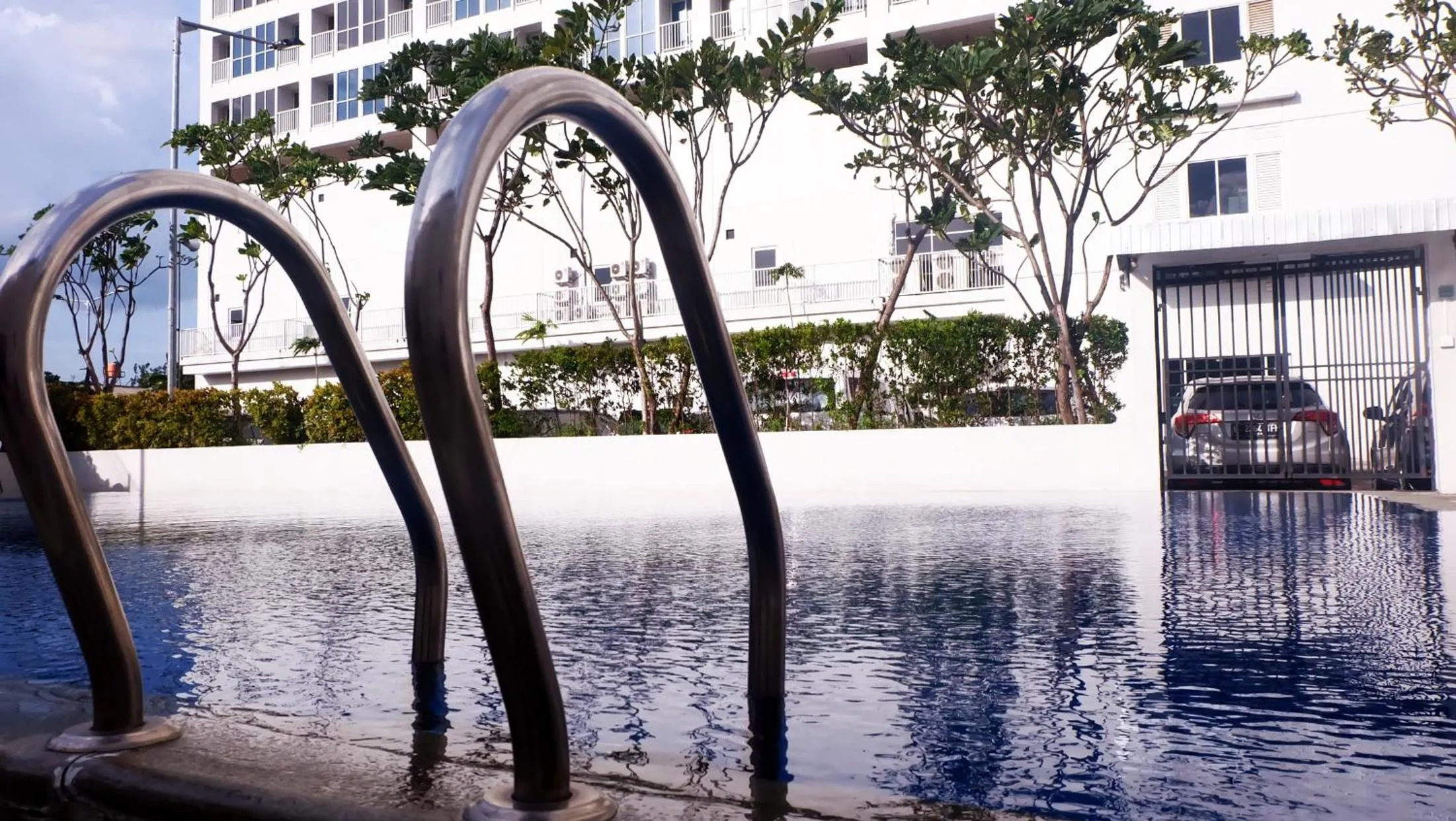 Swimming pool in Modern Look and Comfy Studio Tifolia Apartment By Travelio