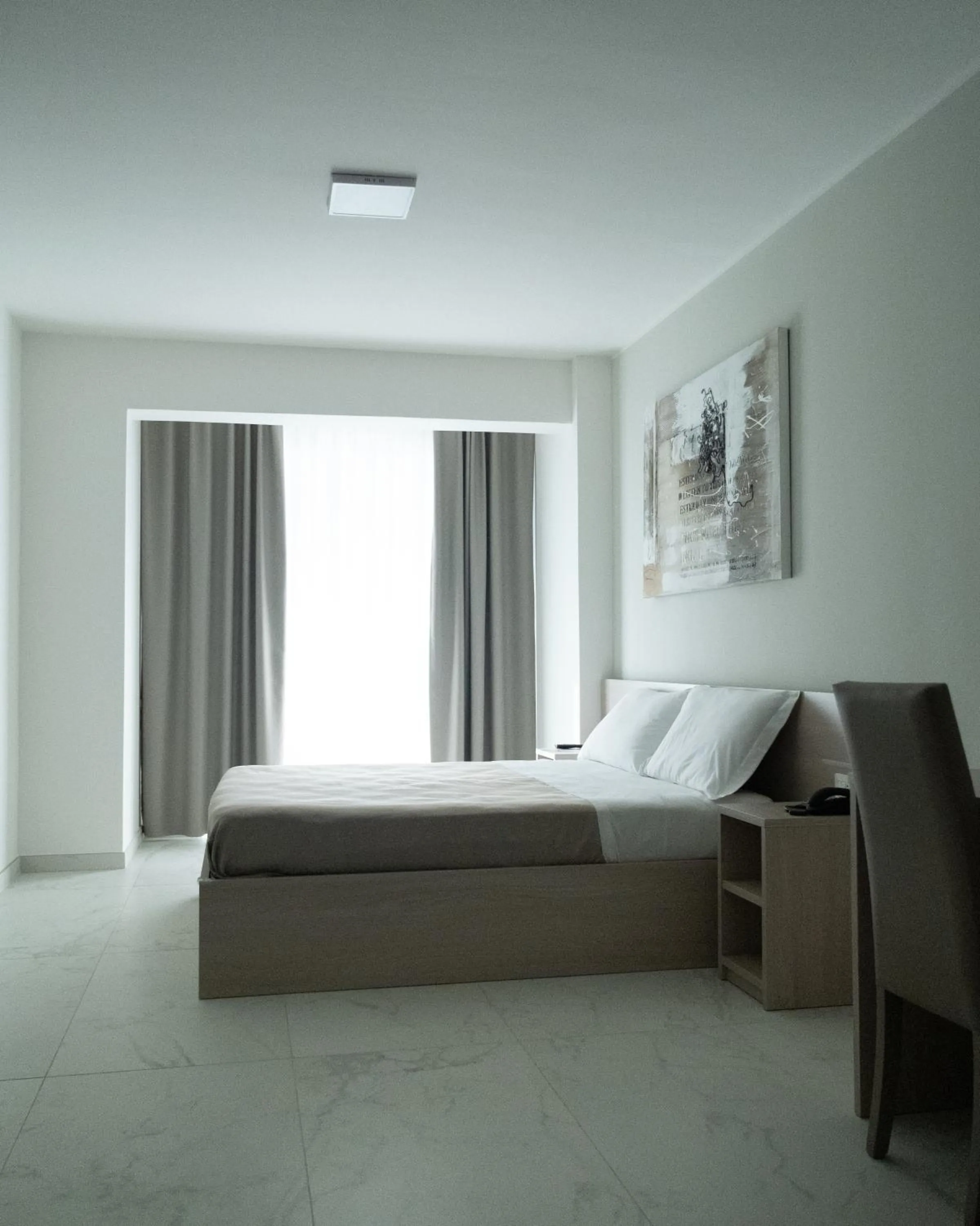 Bed in Hotel Diadema