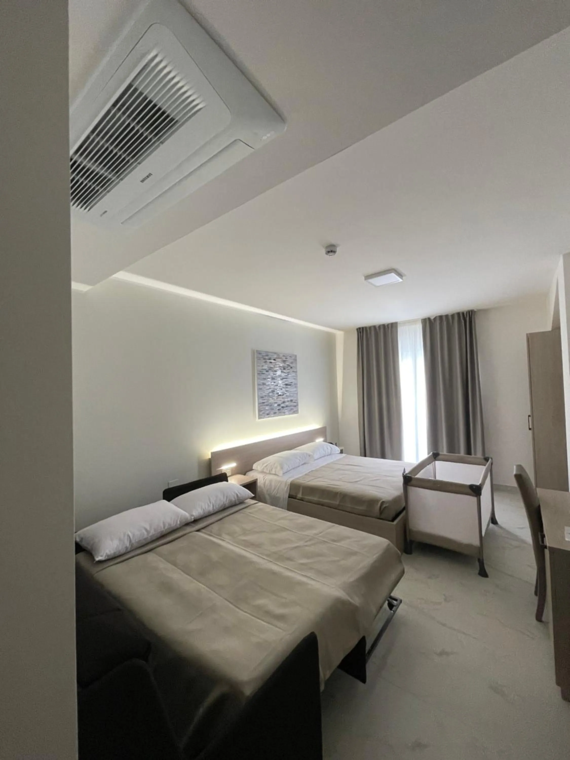 Bed in Hotel Diadema