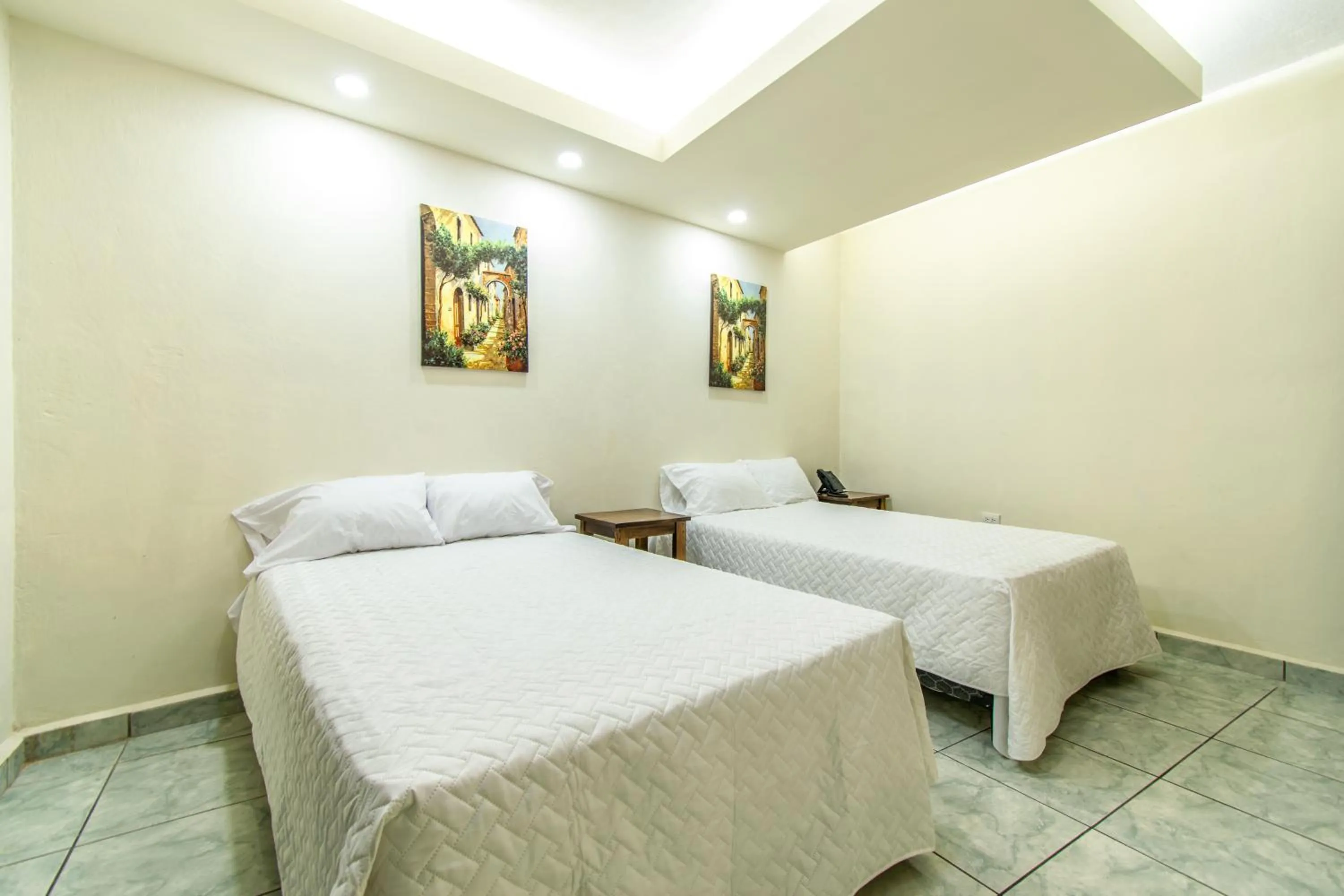 Bed in Lorenzo Hotel