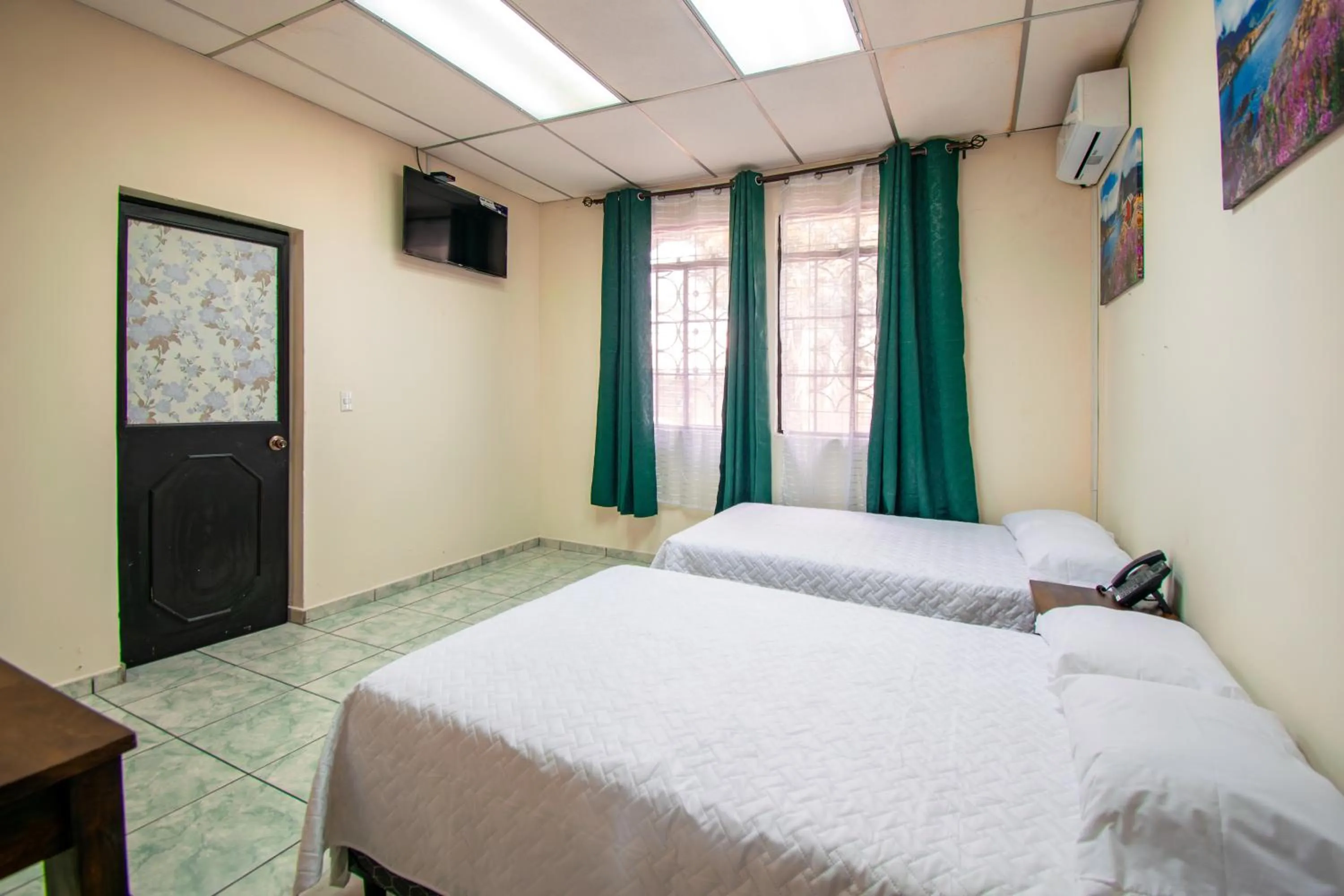 Bed in Lorenzo Hotel