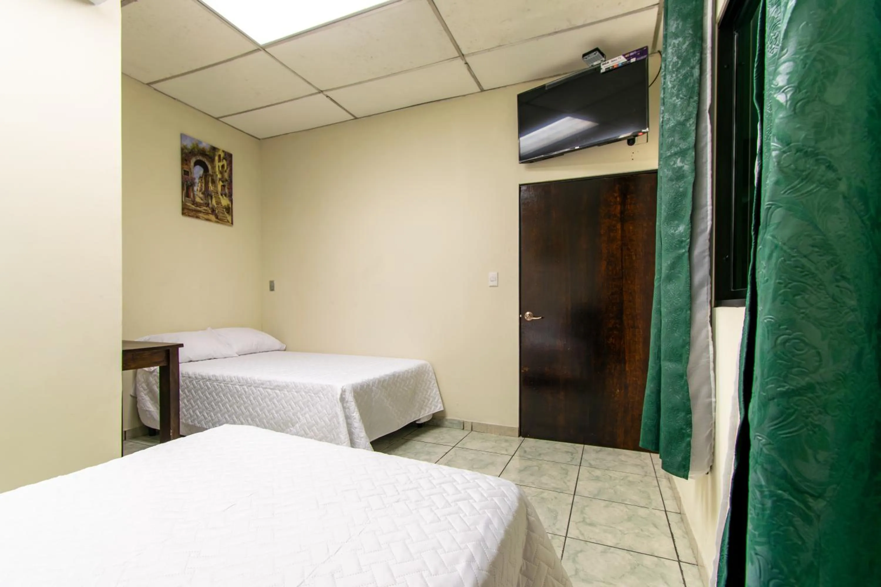 Bed in Lorenzo Hotel