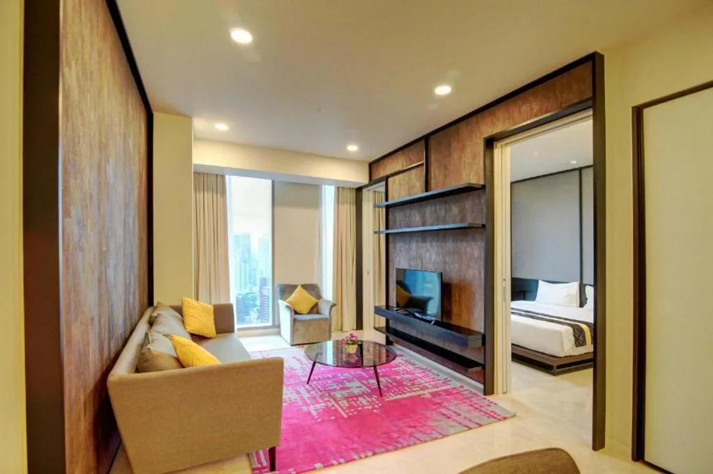 Living room, Bed in Tropicana The Residences by uBook