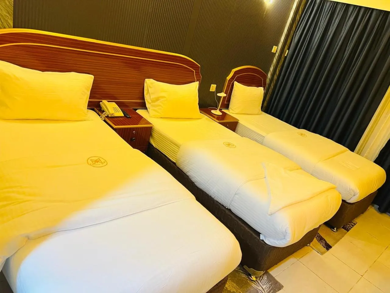 Bed in Galaxy Star Hotel