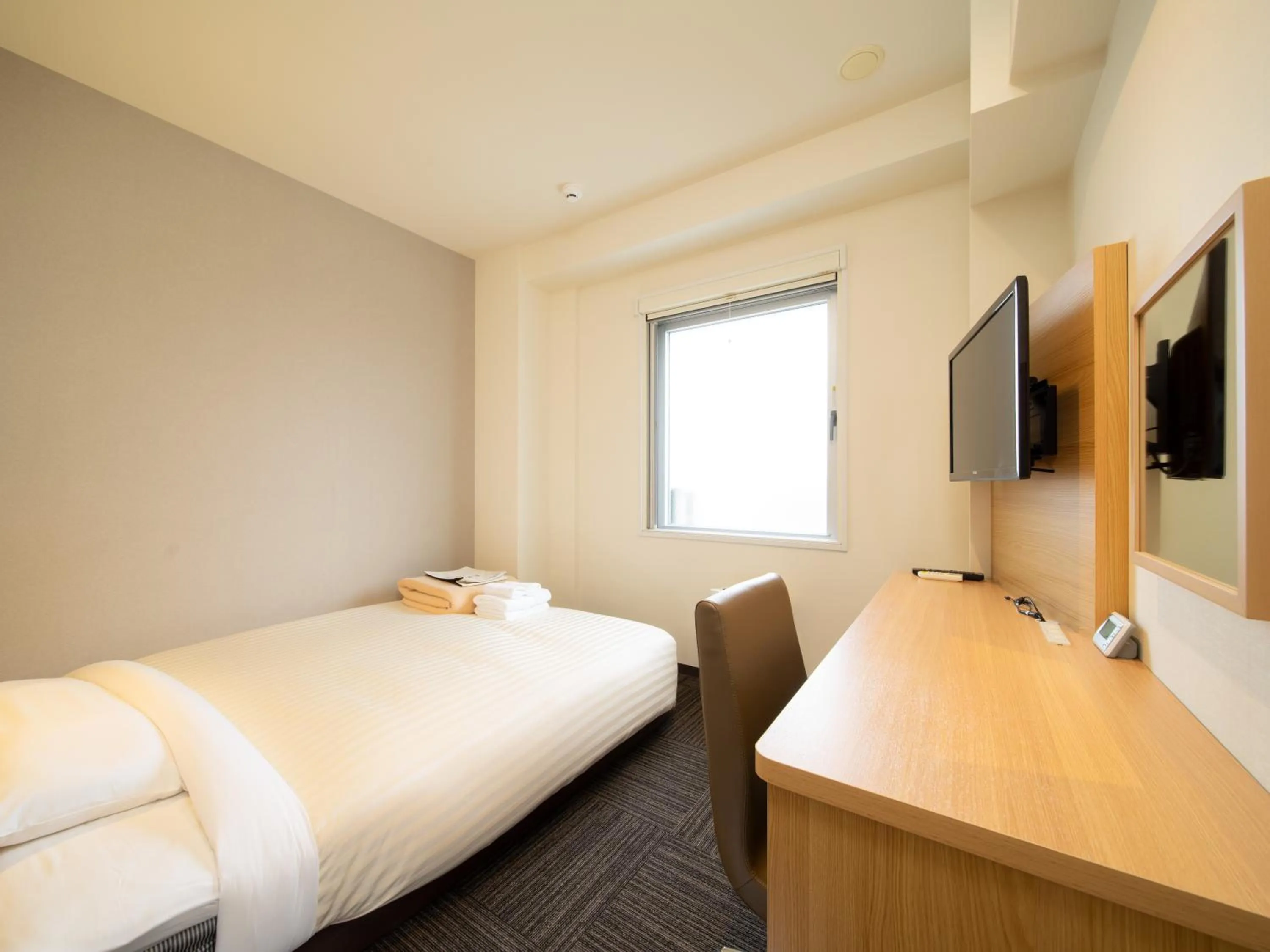 Bed in Super Hotel Sapporo Susukino