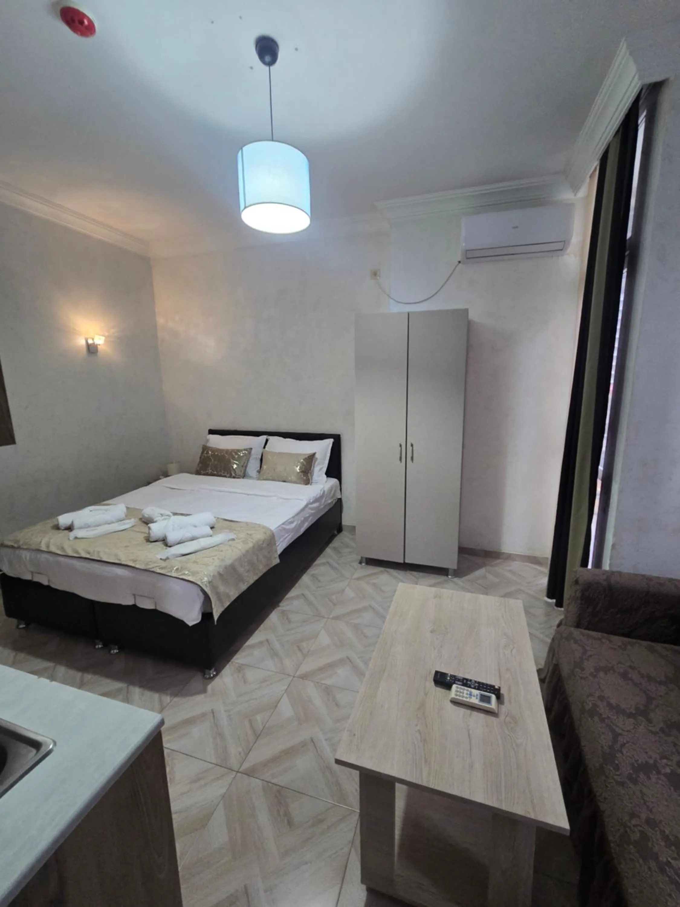 Kitchen or kitchenette, Bed in Batumi Inn Hotel