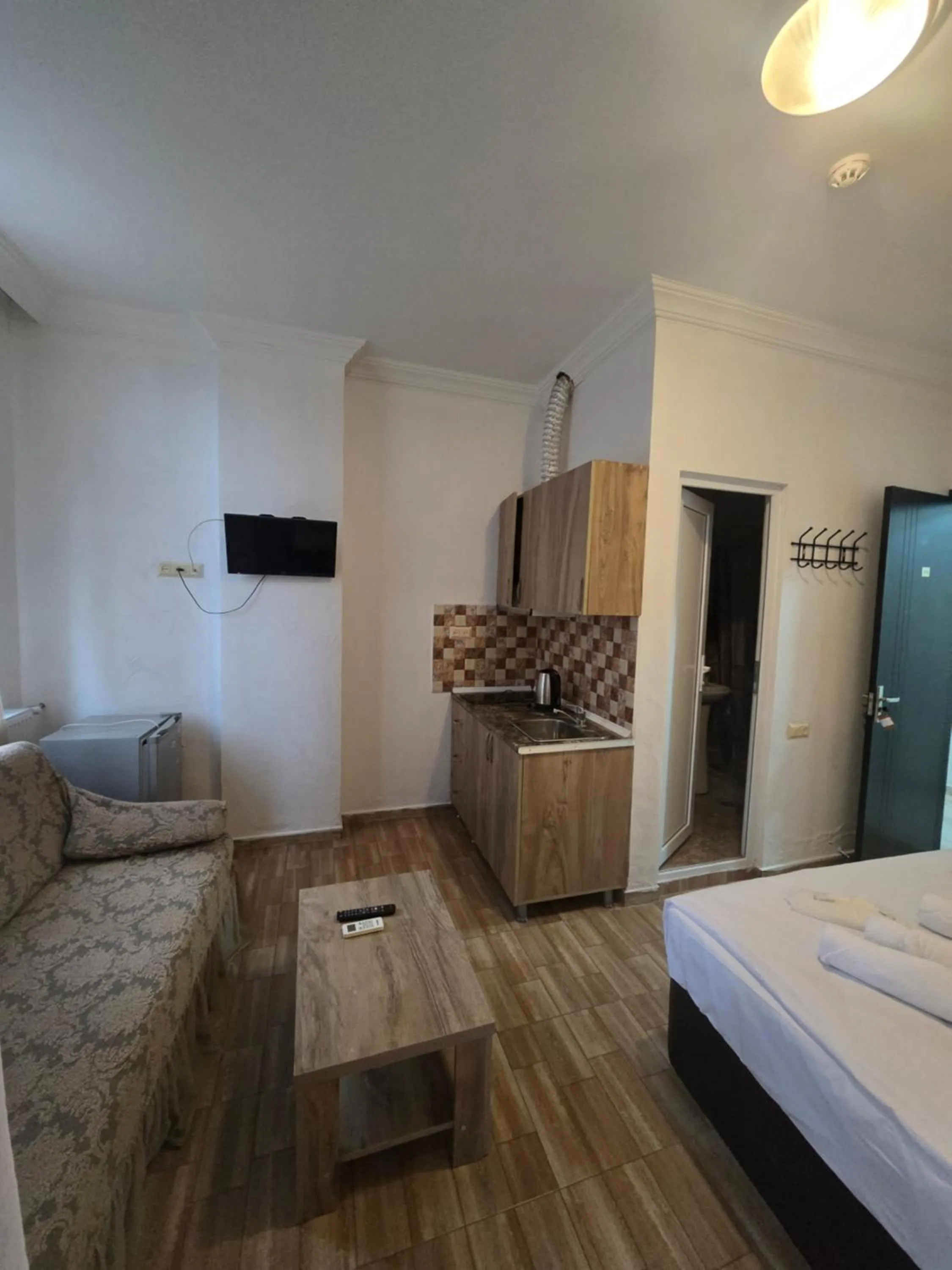 Kitchen or kitchenette, Bed in Batumi Inn Hotel