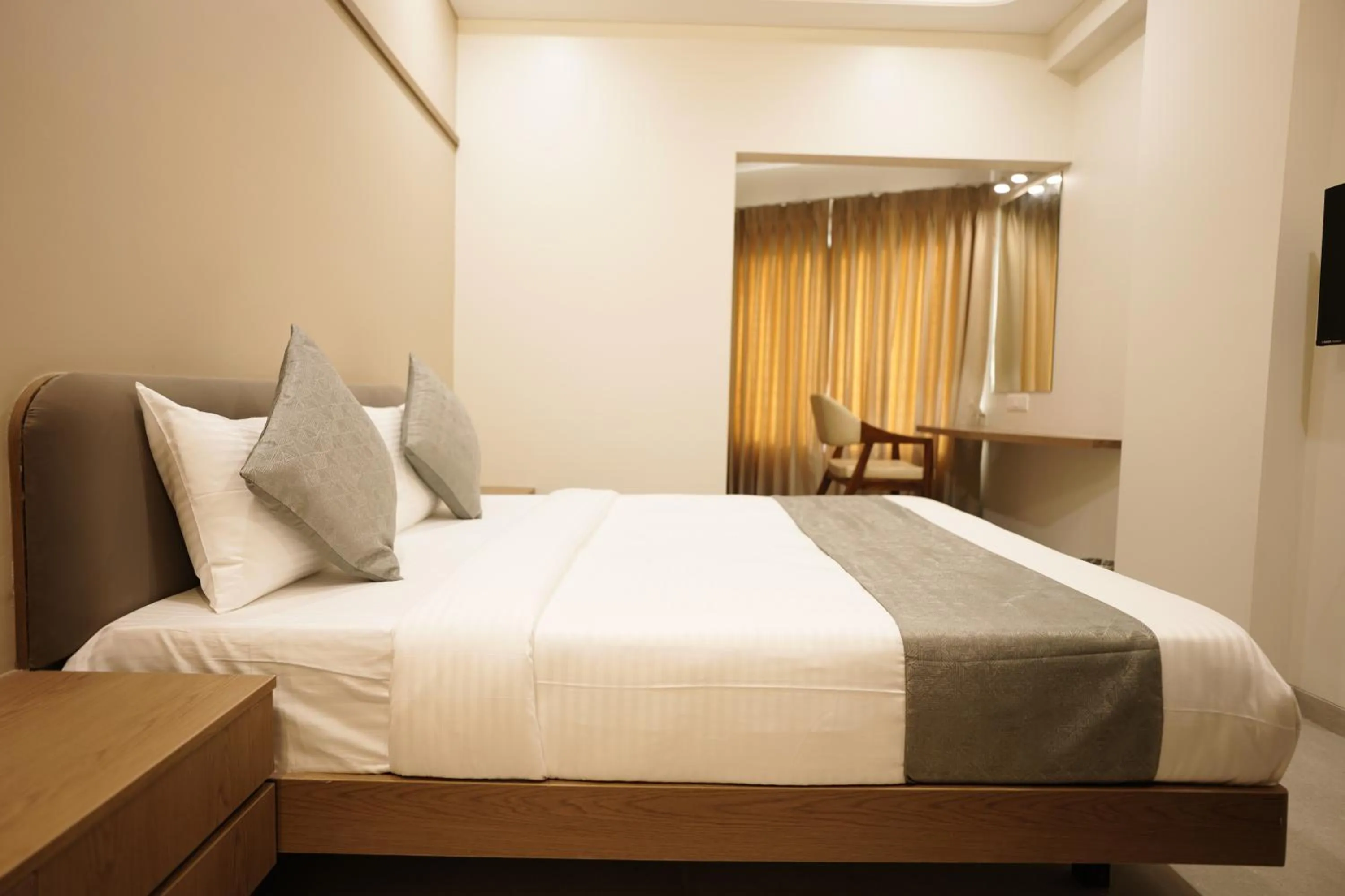 Bed in A Square Executive Hotel