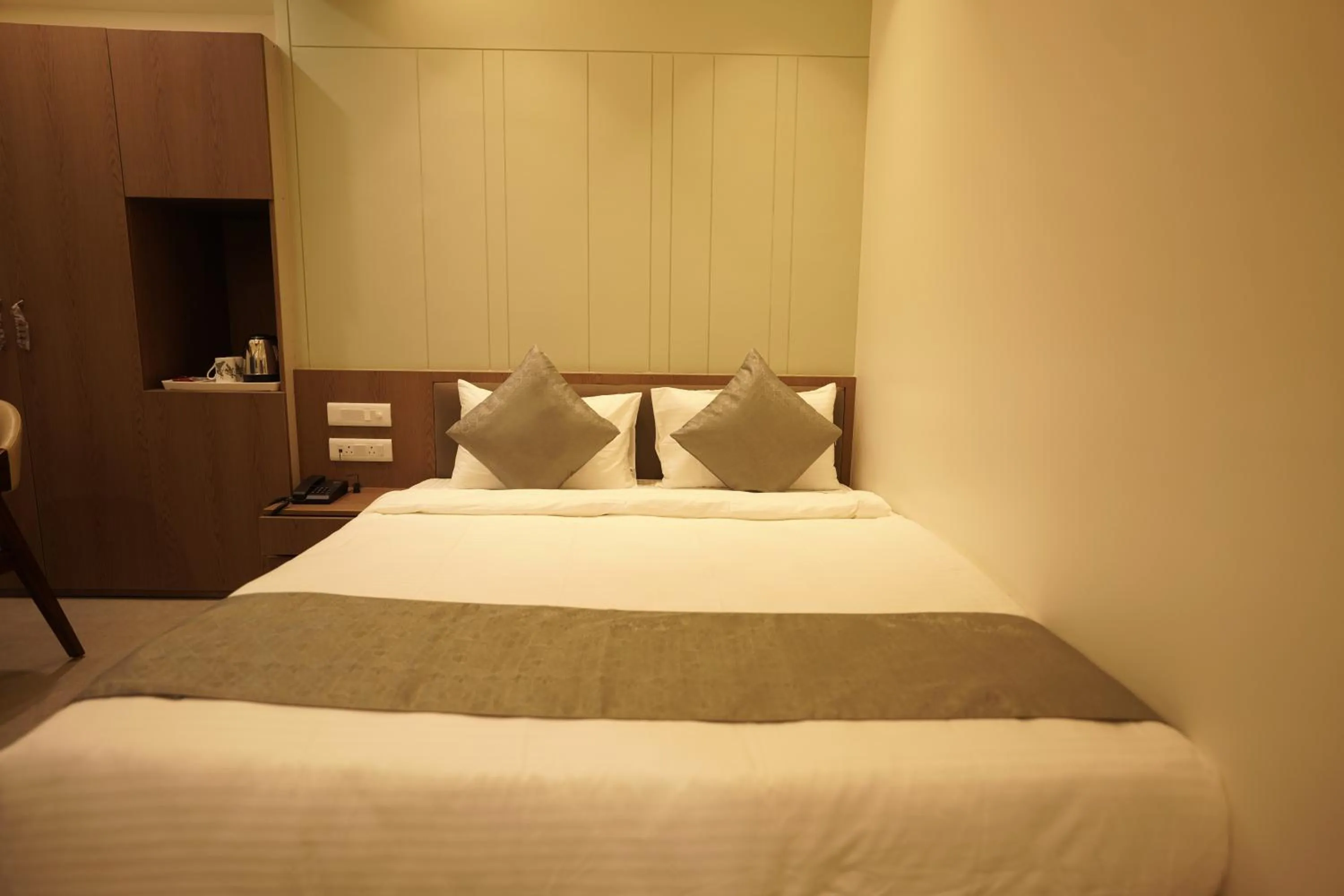 Bed in A Square Executive Hotel