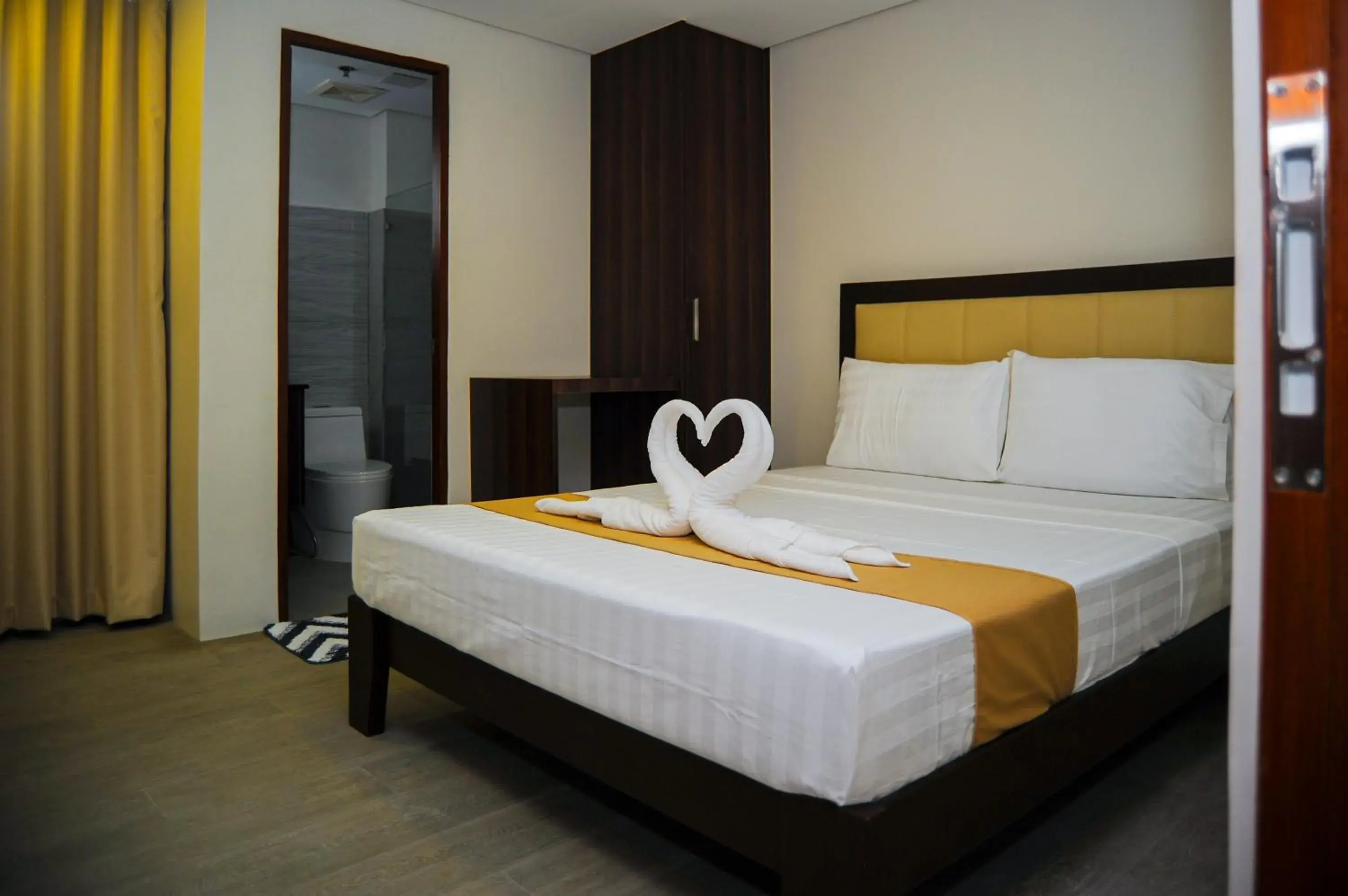 Bed in Kaia Isabelle Hotel Puerto Princesa Bed in Kaia Isabelle Hotel Puerto Princesa