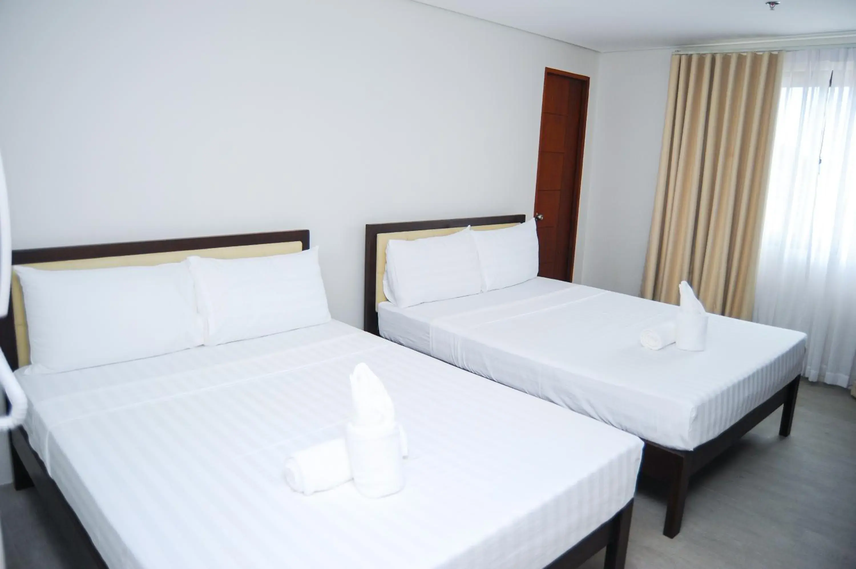 Bed in Kaia Isabelle Hotel Puerto Princesa Bed in Kaia Isabelle Hotel Puerto Princesa