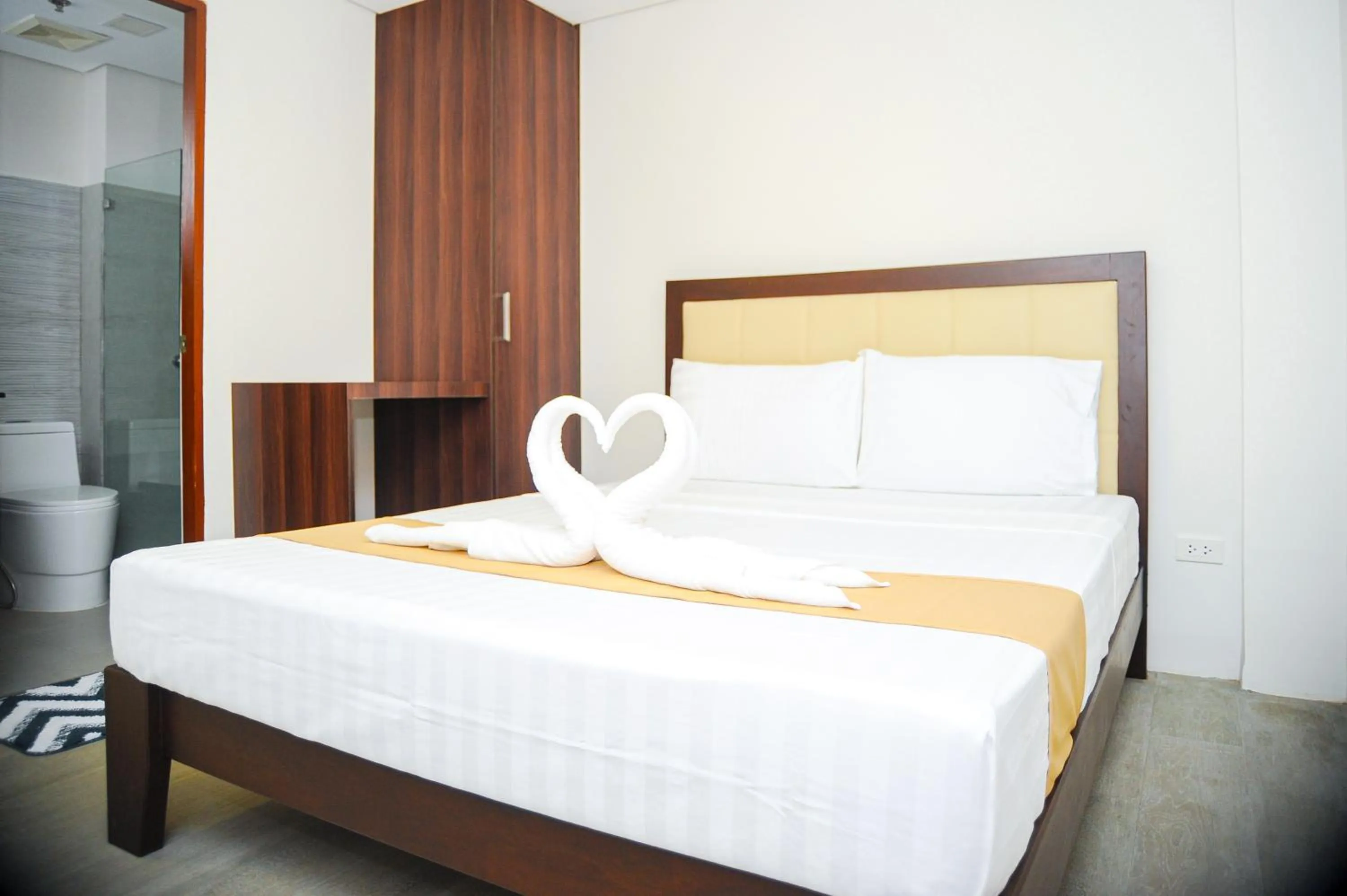 Bed in Kaia Isabelle Hotel Puerto Princesa