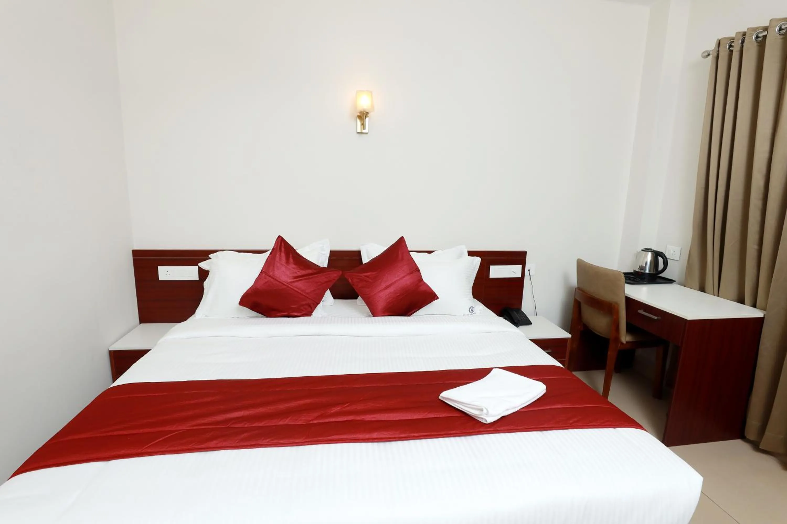 Bed in K Grandeur Hotels