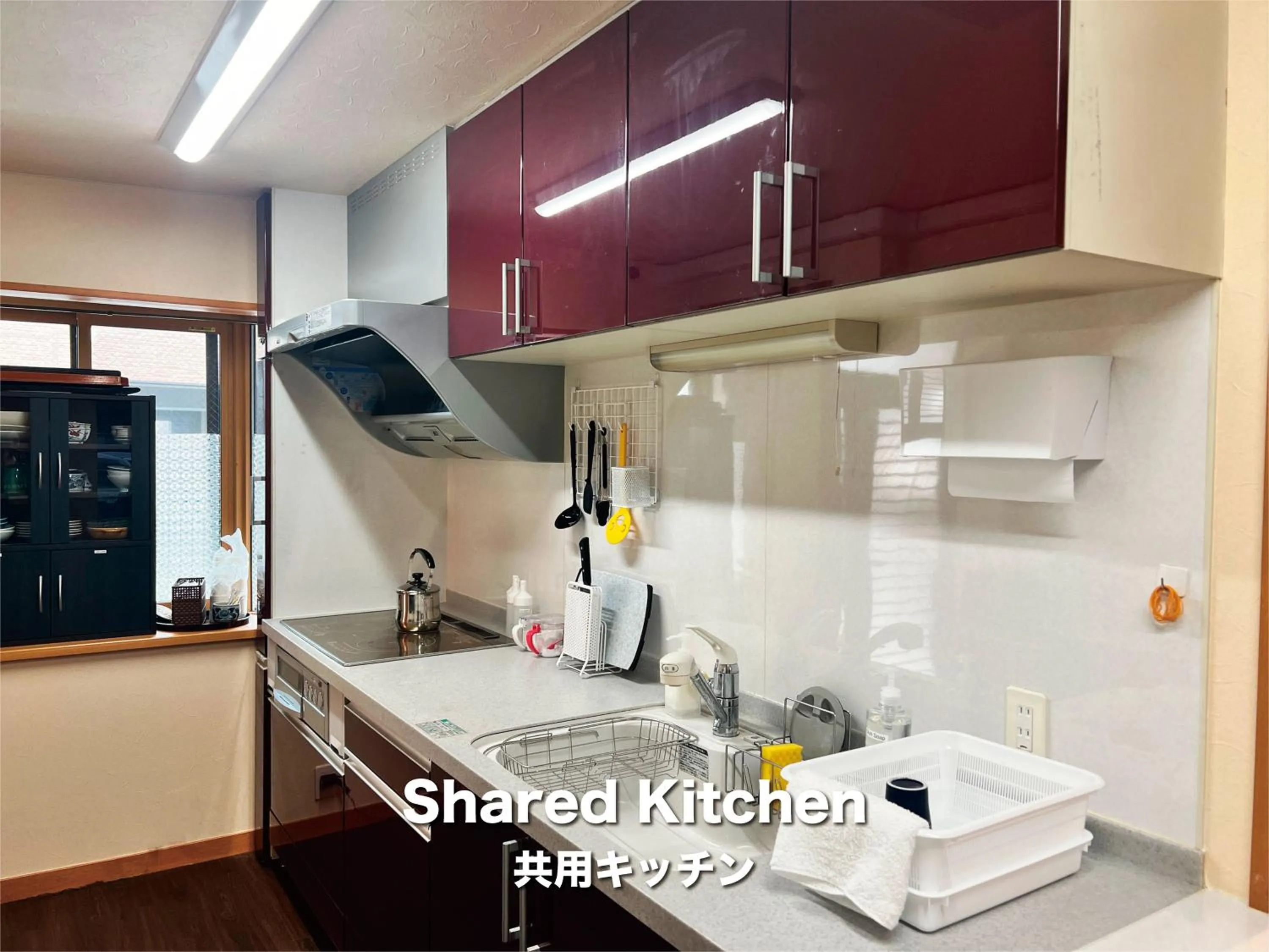 Communal kitchen in Jinya Sunset Inn by Murasaki
