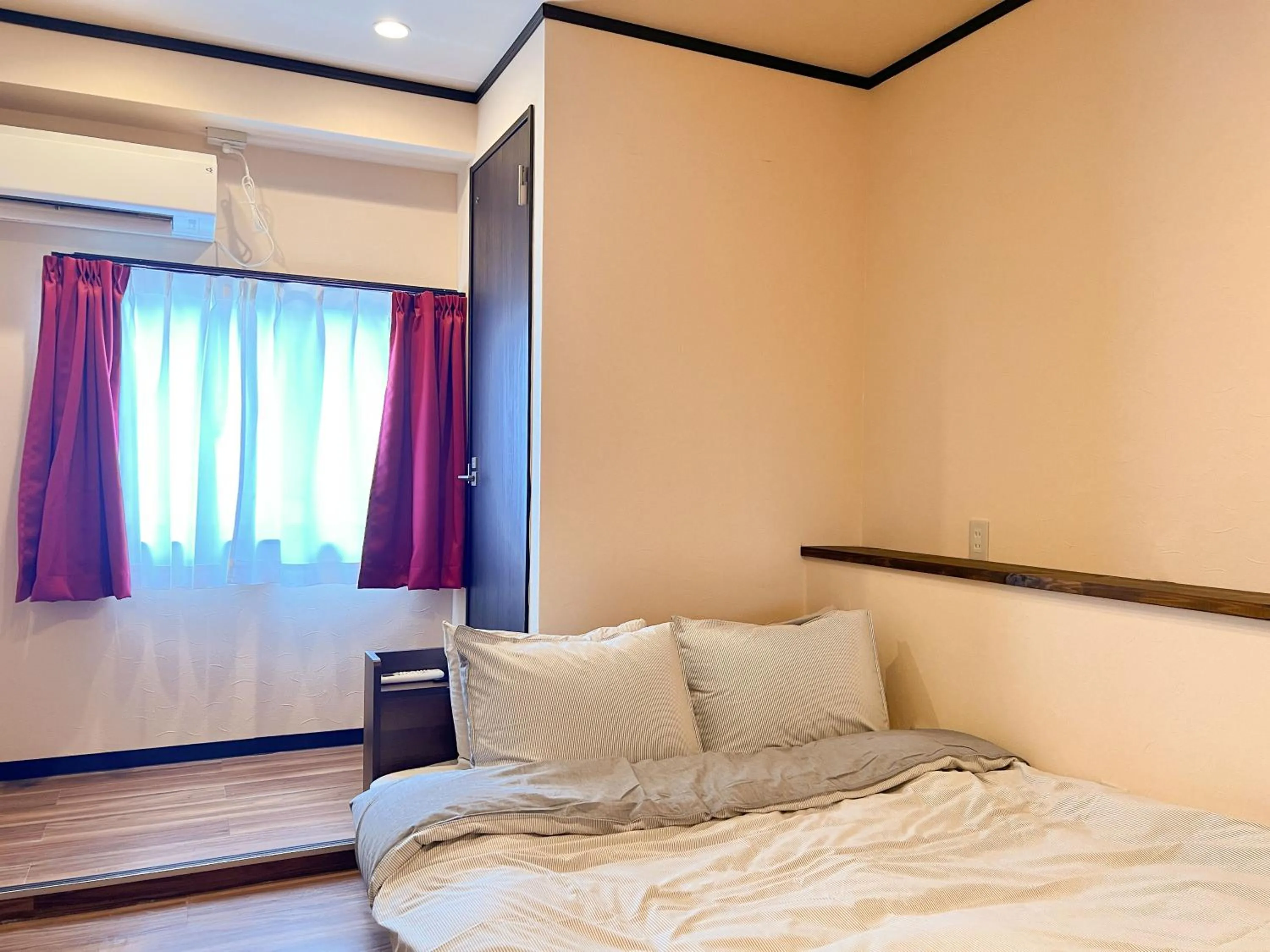 Bed in Jinya Sunset Inn by Murasaki