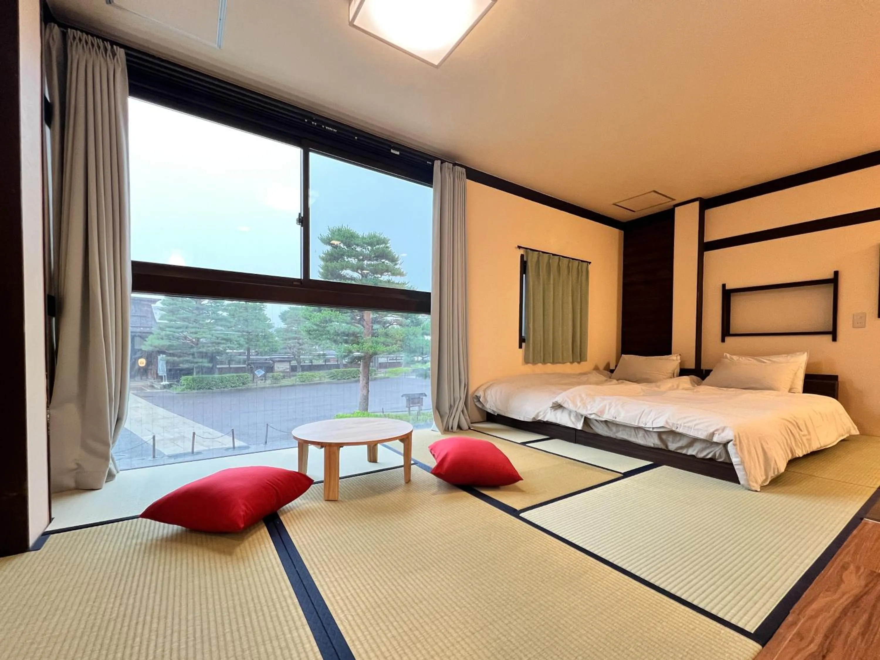 Bed in Jinya Sunset Inn by Murasaki