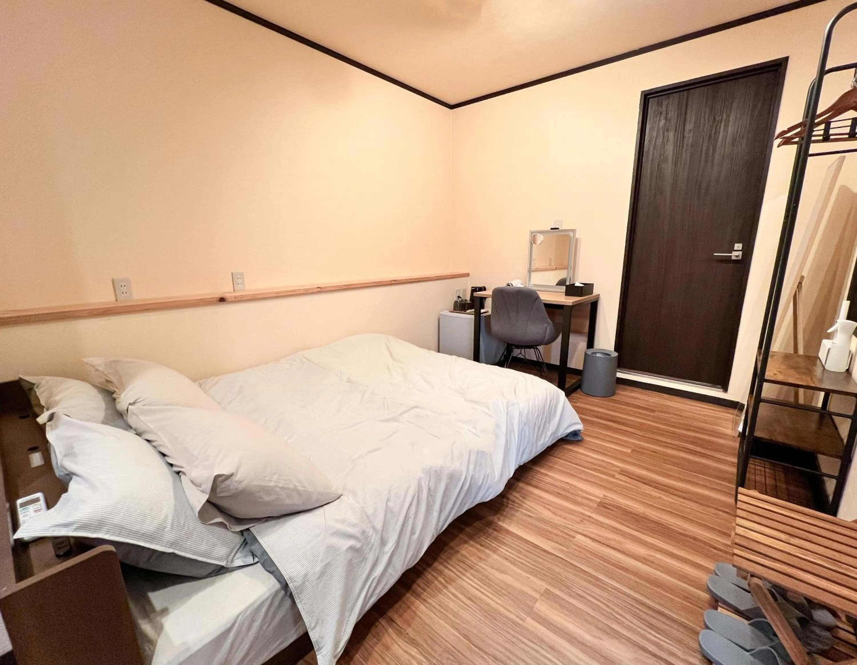 Bed in Jinya Sunset Inn by Murasaki