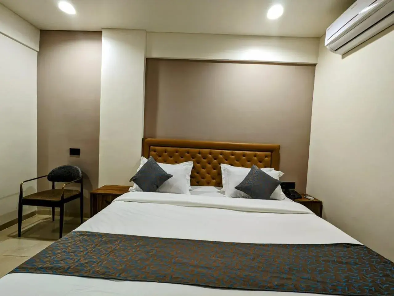 Bed in Hotel Majestic By NxtJen Hospitality Bed in Hotel Majestic By NxtJen Hospitality