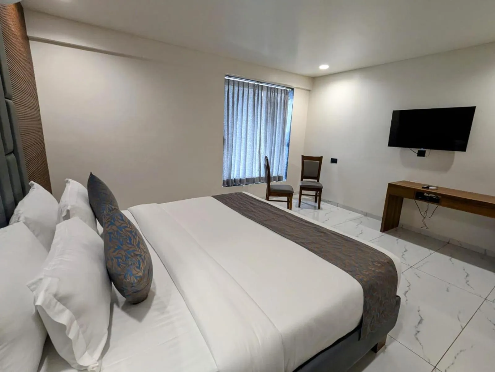 Bed in Hotel Majestic By NxtJen Hospitality