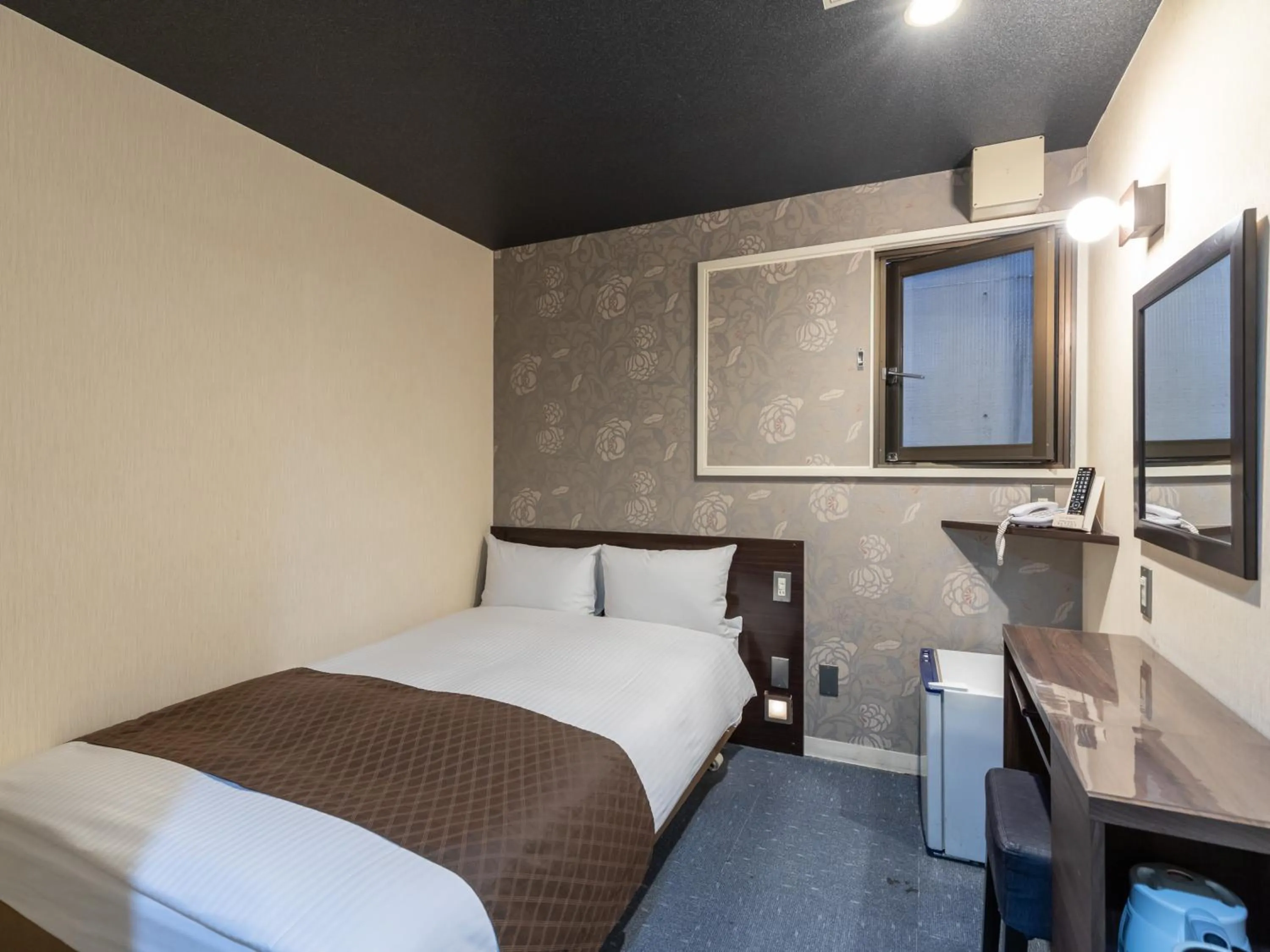 Bed in Tabist Takamatsu Pearl Hotel