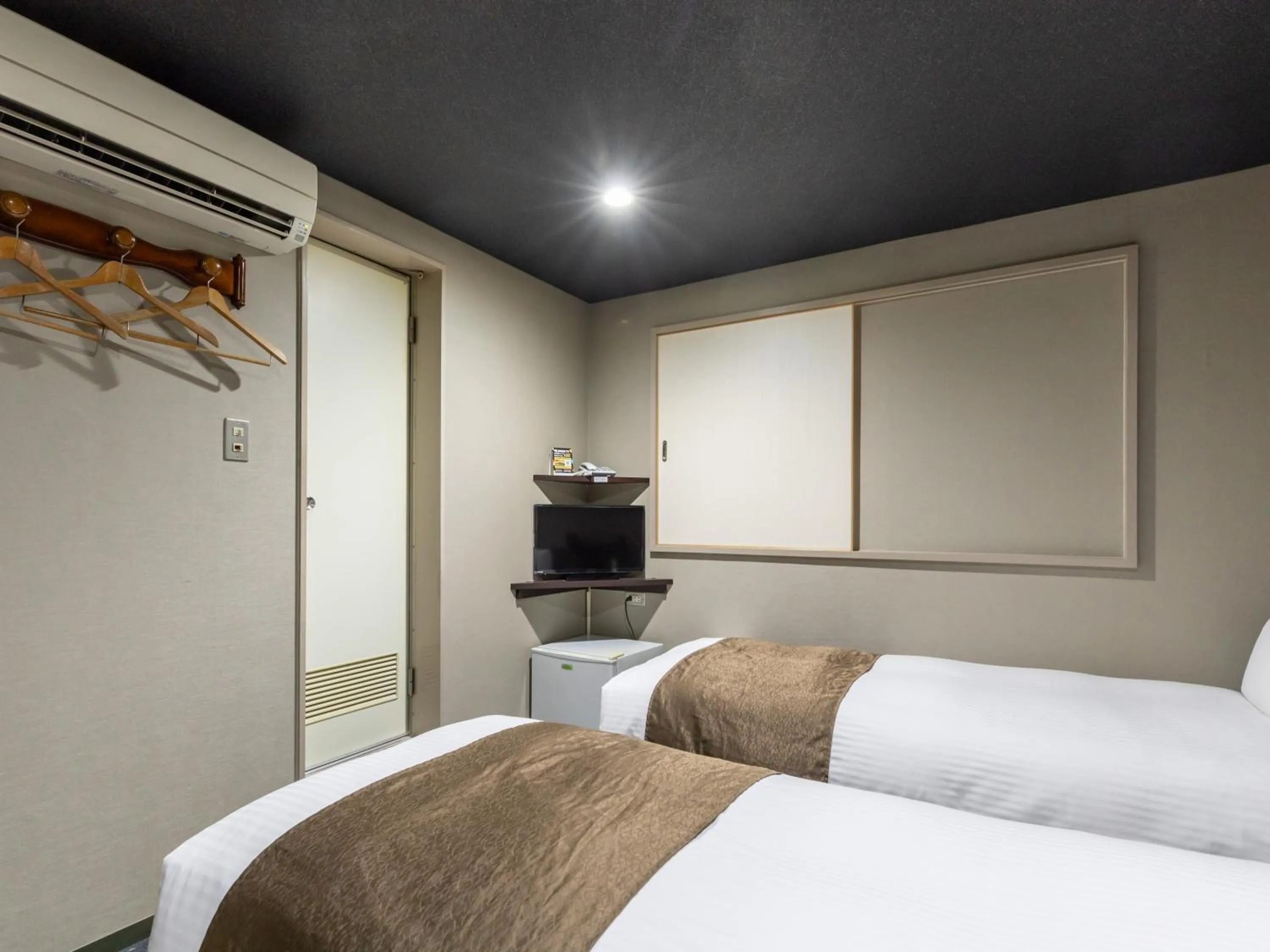 Bed in Tabist Takamatsu Pearl Hotel