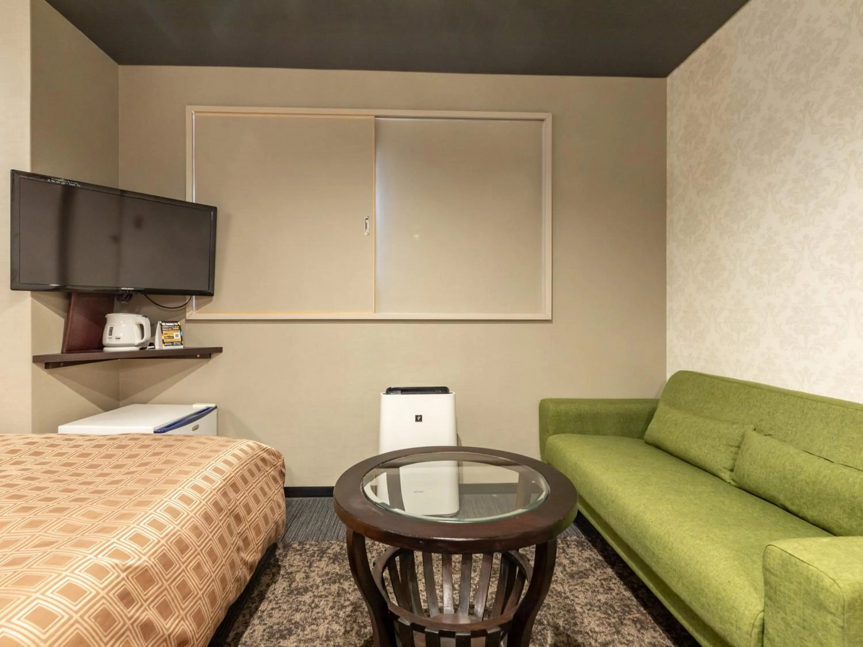 Bed in Tabist Takamatsu Pearl Hotel