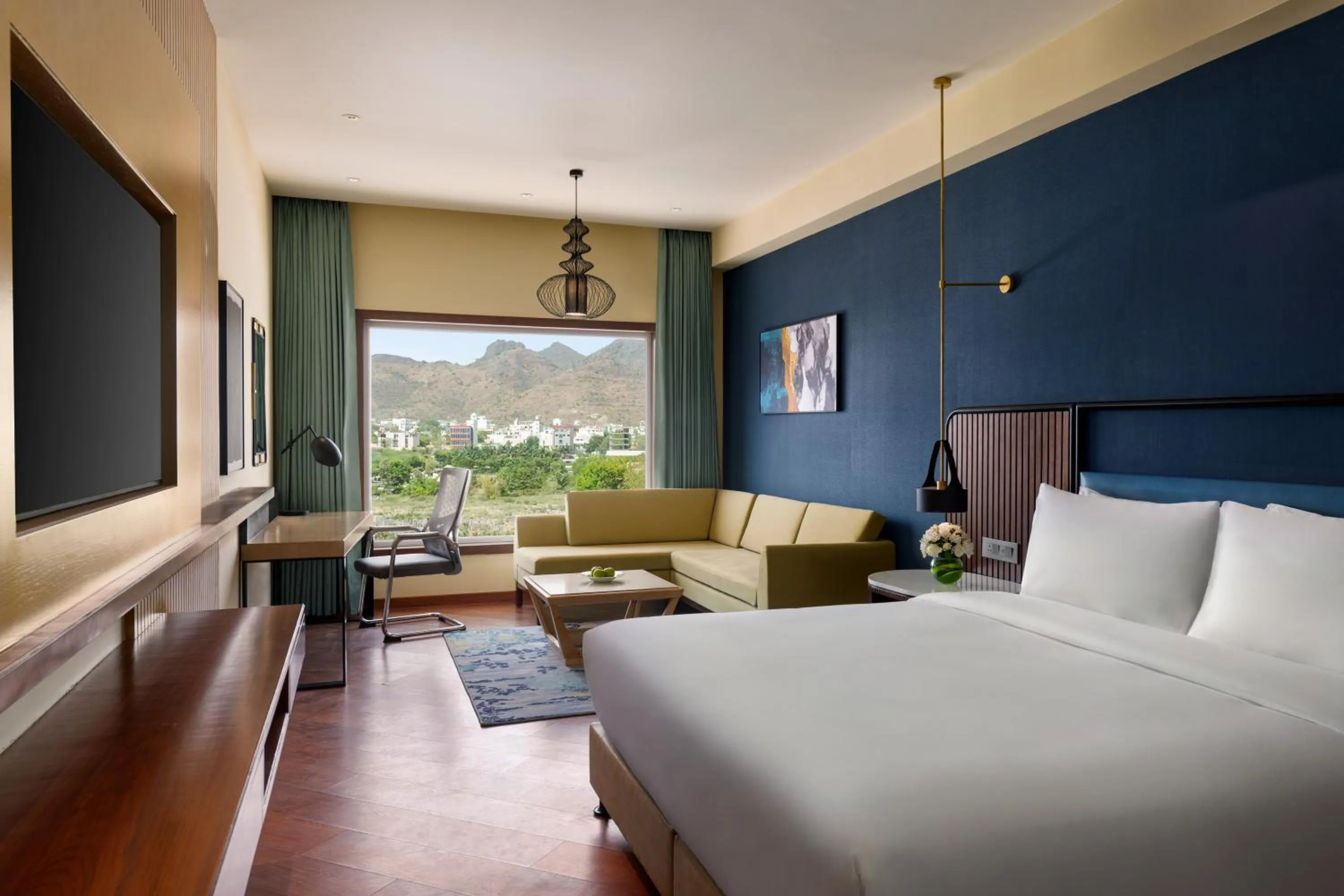 Bed in Ramada Encore by Wyndham Udaipur Roopnagar