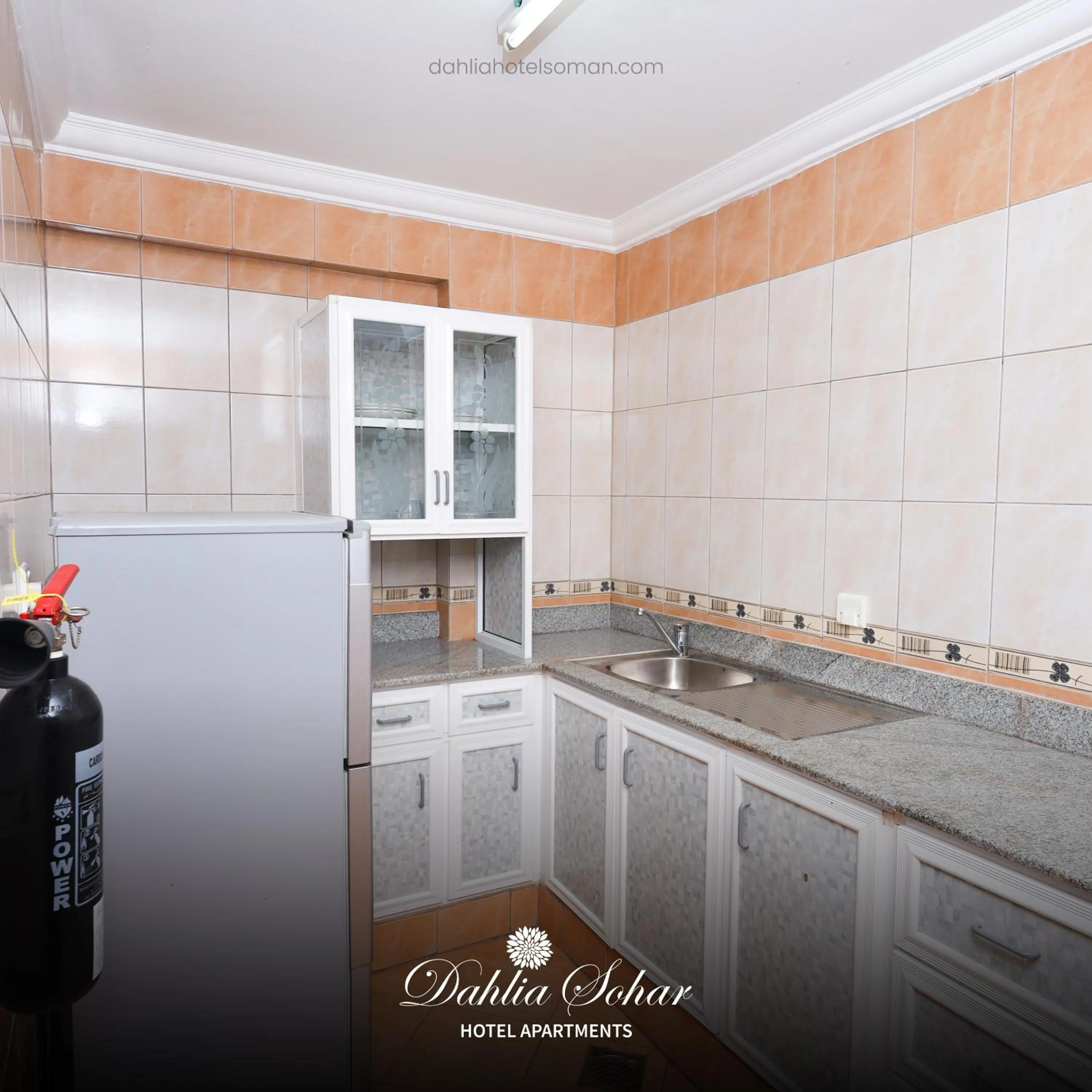 Kitchen or kitchenette in Dahlia Sohar Hotel Apartments