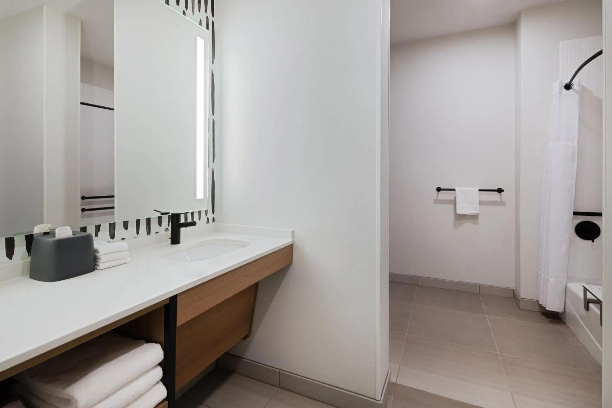 Bathroom in Atwell Suites Kansas City Airport by IHG