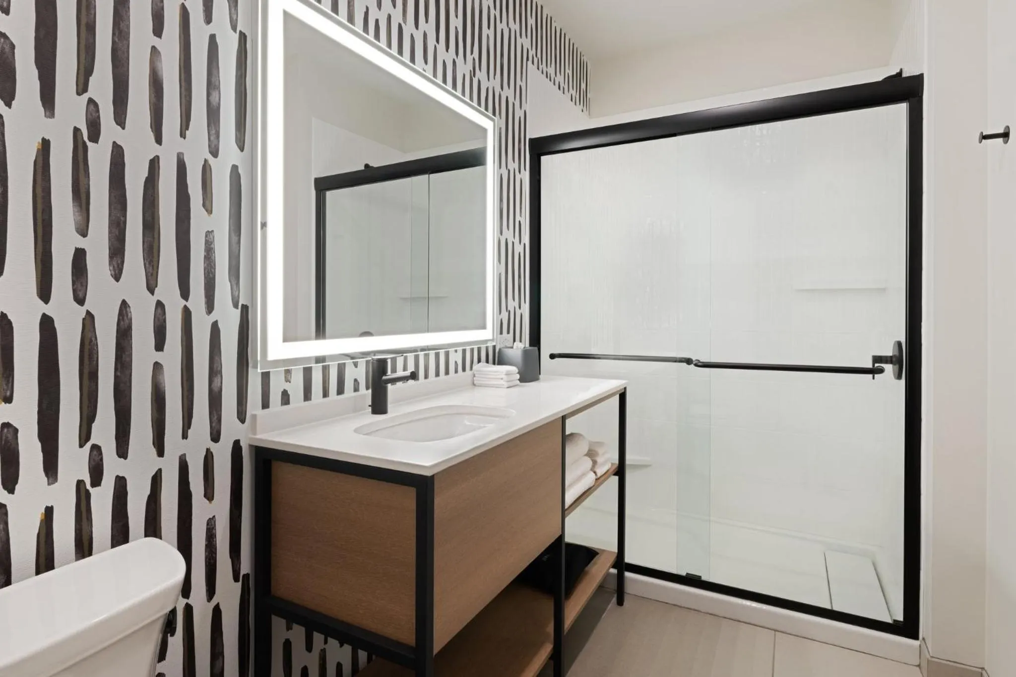 Bathroom in Atwell Suites Kansas City Airport by IHG