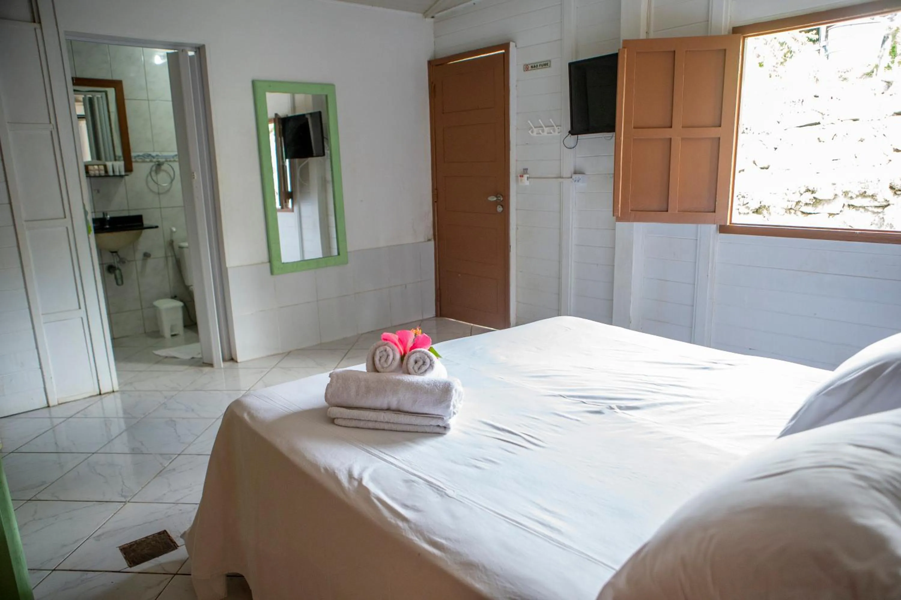 Bed in Pousada Sol e Mar Noronha