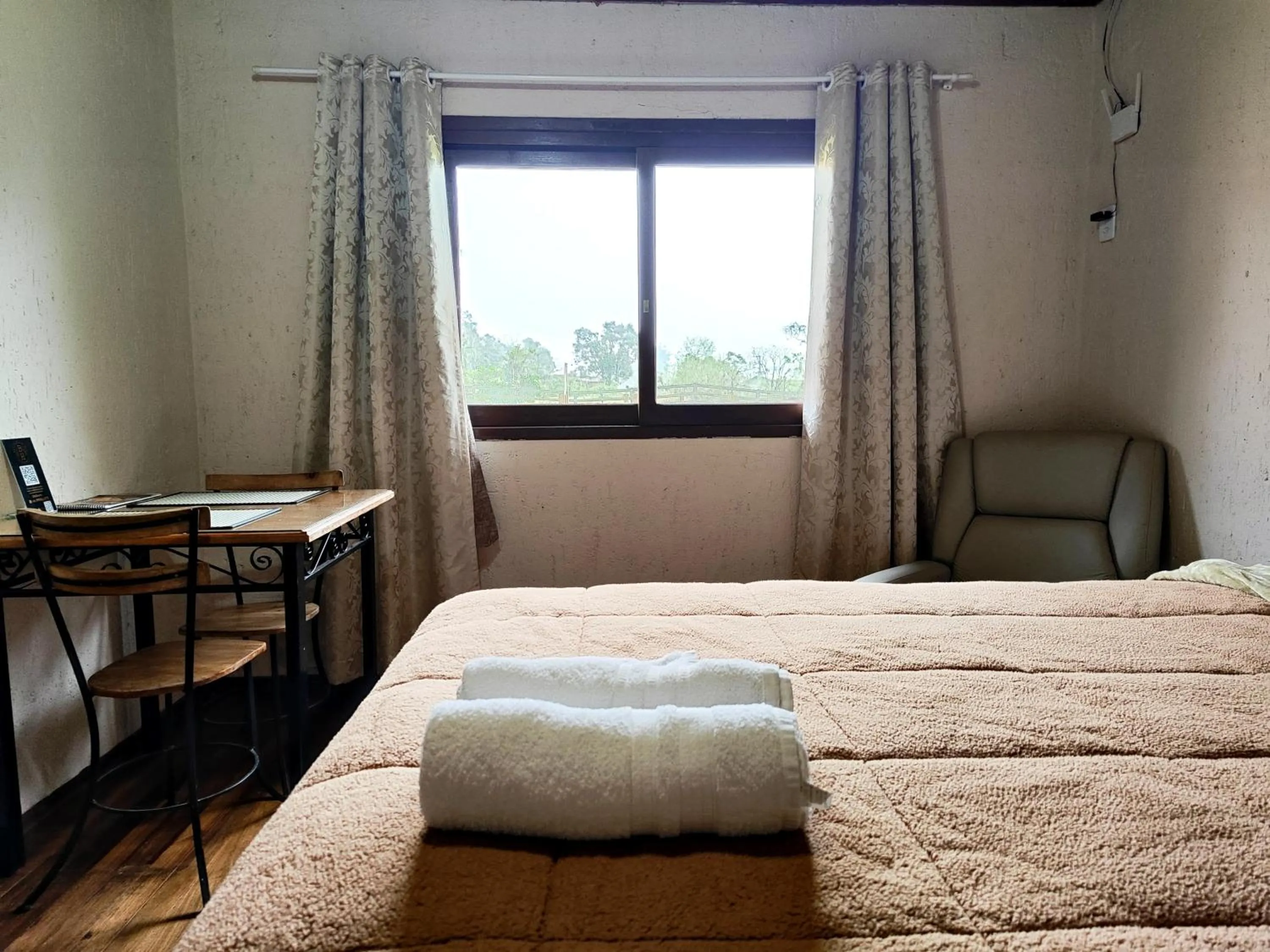 Bed in Chalés Pousada Malacara