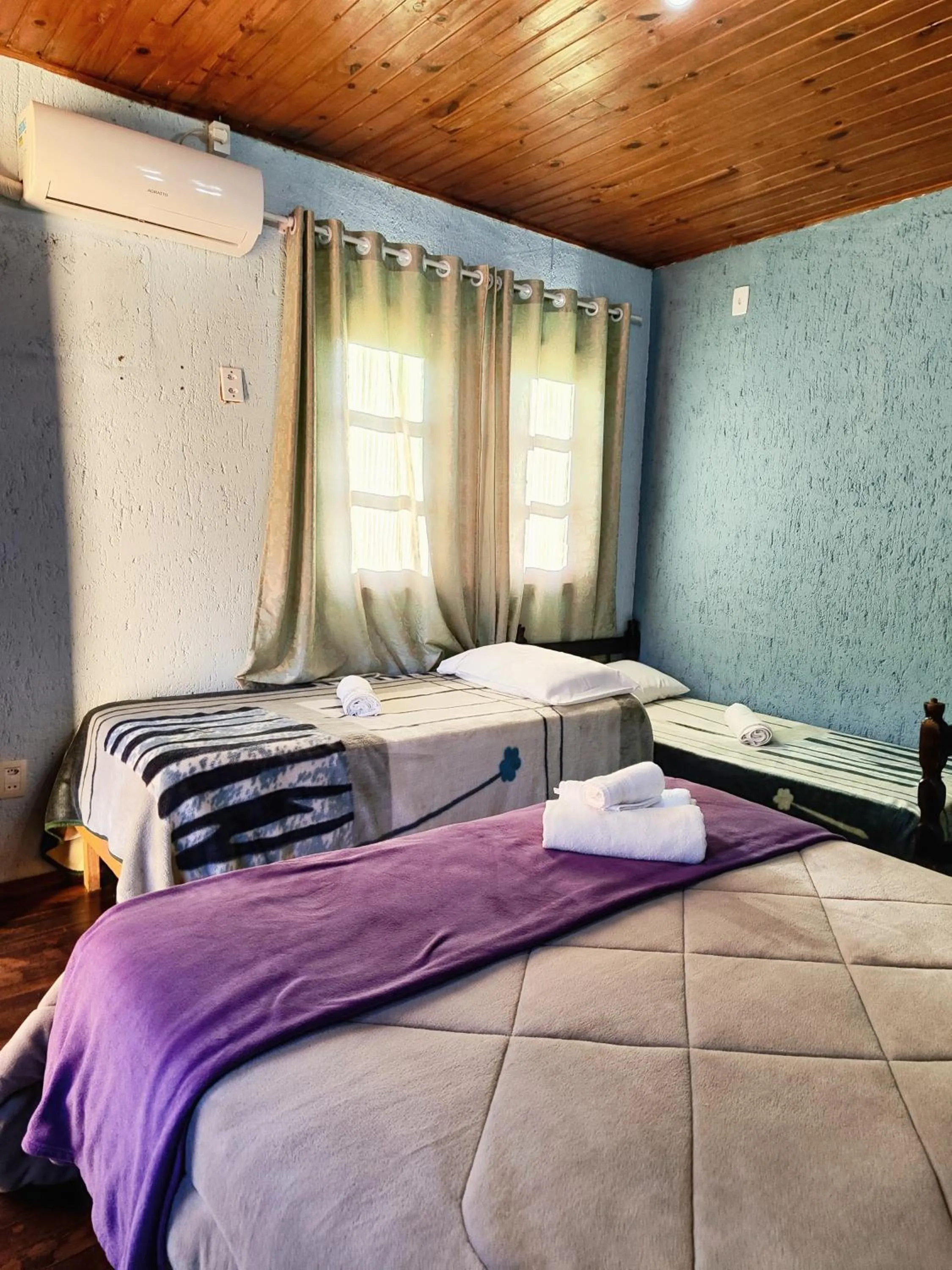 Bed in Chalés Pousada Malacara