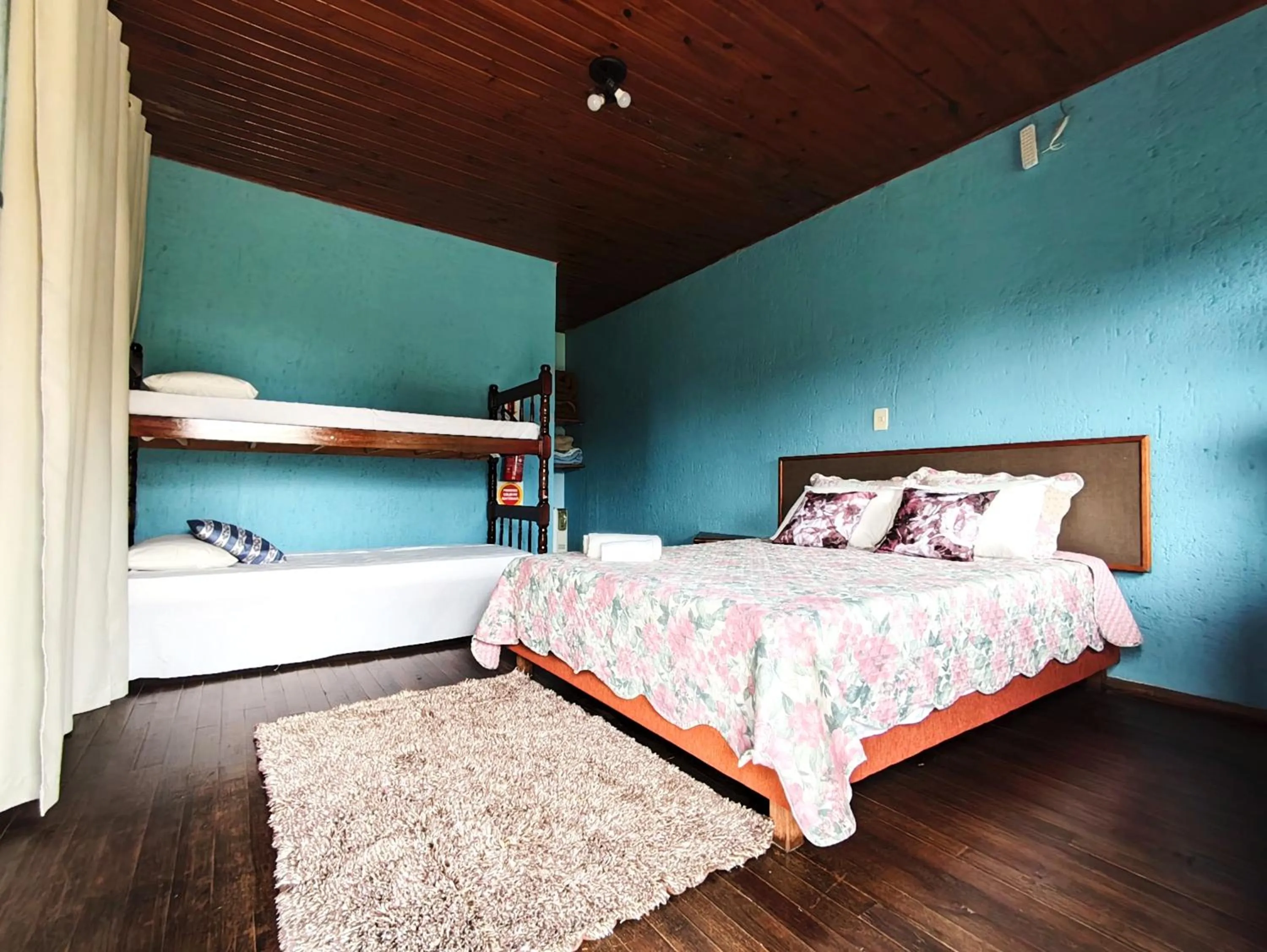 Bed in Chalés Pousada Malacara