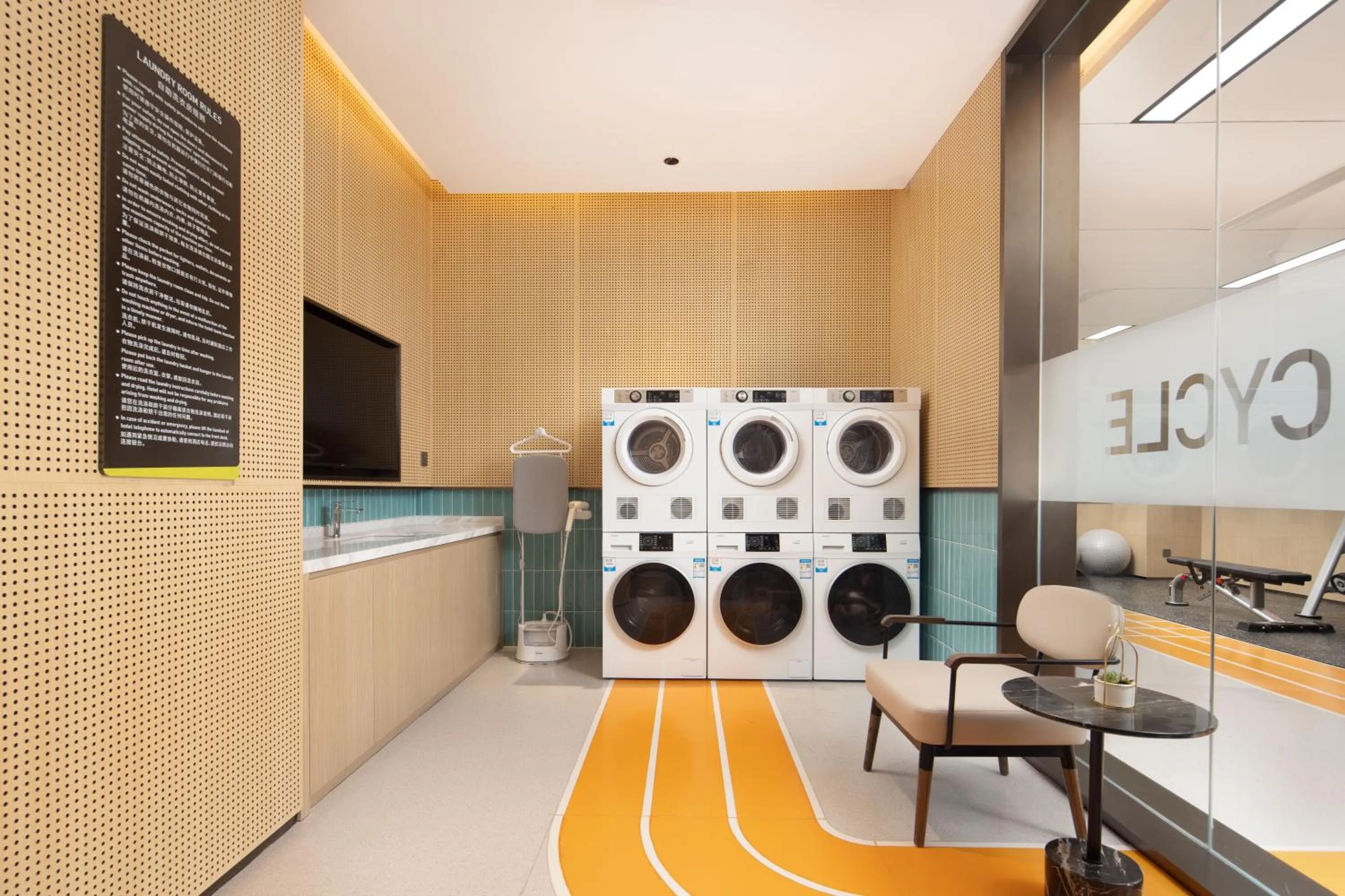 washing machine in Home2 Suite by Hilton Hangzhou Qianjiang New Town